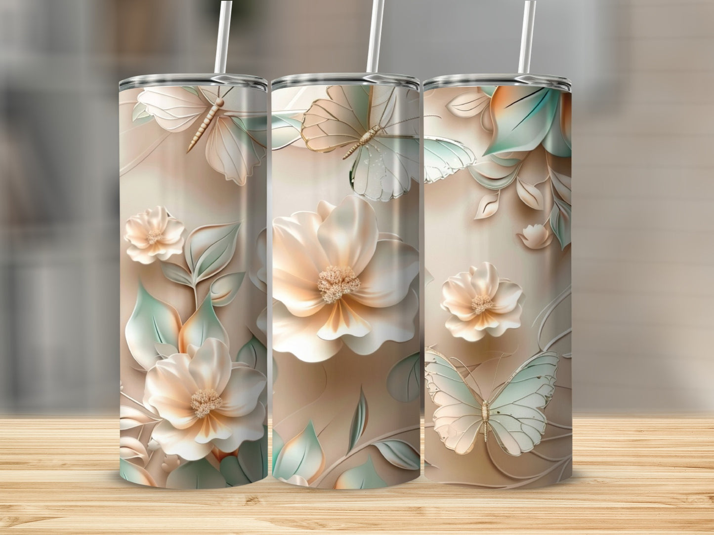 Three tumblers with delicate floral and butterfly designs.