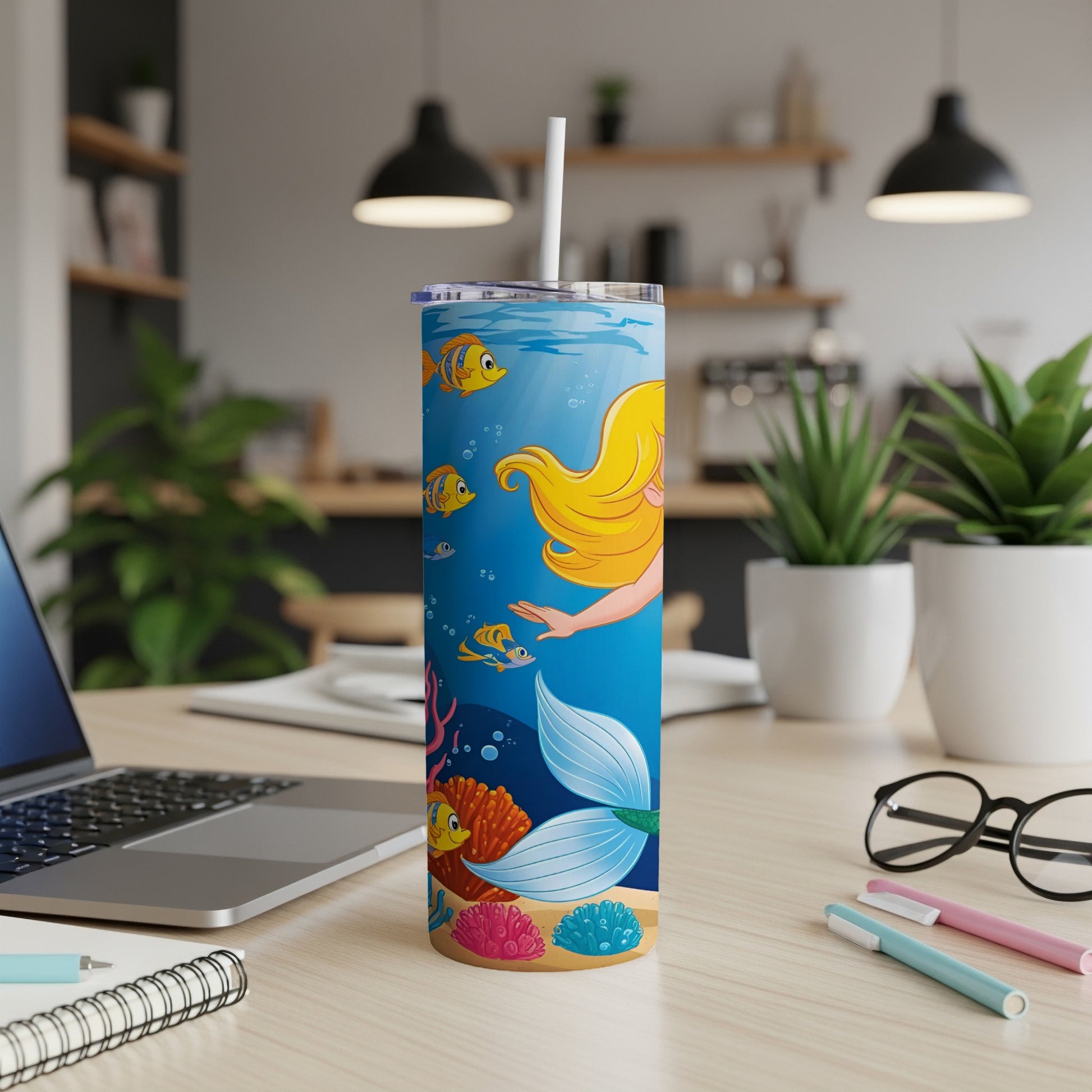 Mermaid tail and ocean life on a tumbler with a straw.
