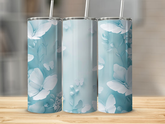 Three light blue tumblers with white floral and butterfly designs.