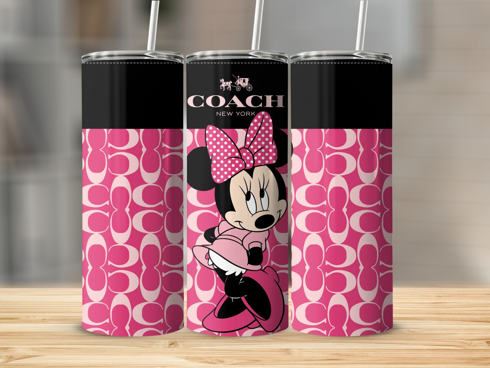 Three tumblers featuring Minnie Mouse and the Coach logo on a pink pattern.