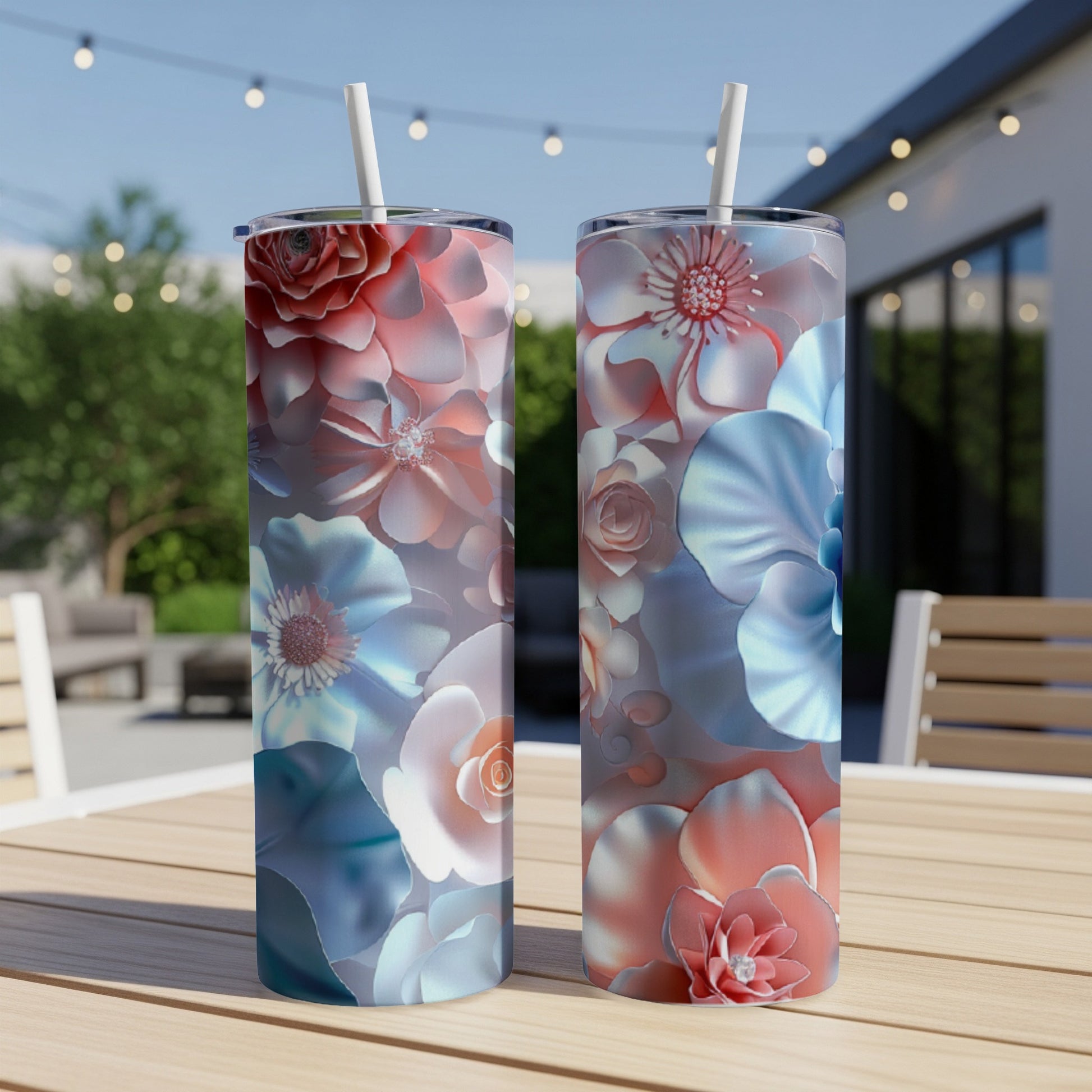 Two tall tumblers with a delicate floral pattern in shades of pink and blue.