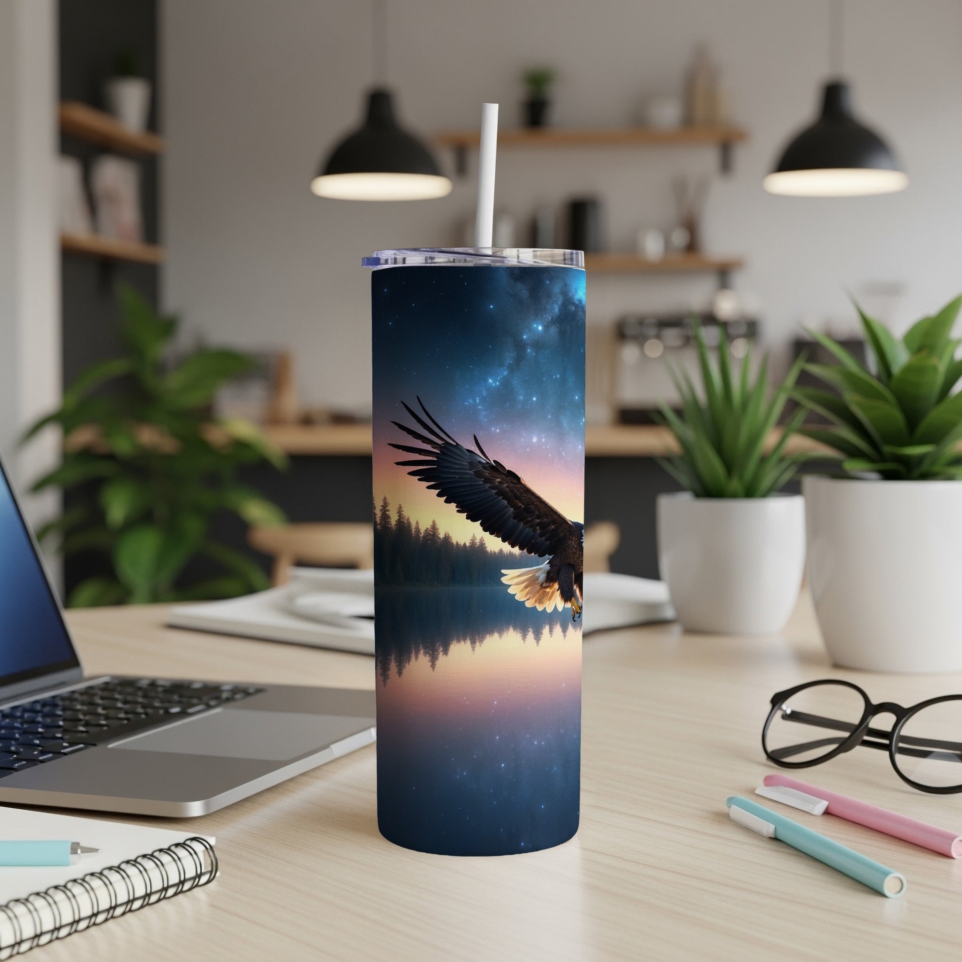 Tall tumbler with a soaring eagle and starry night sky design.