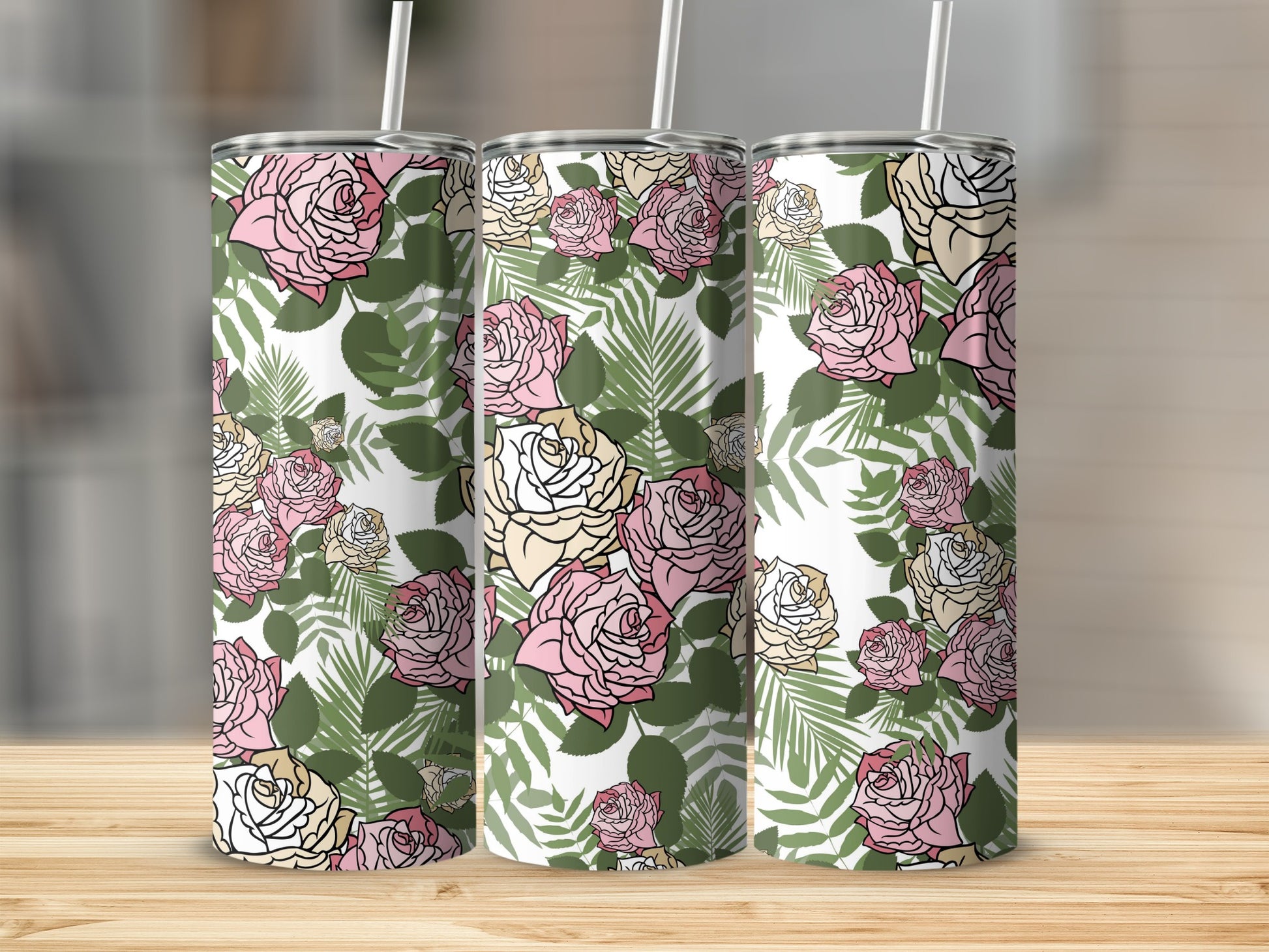 Three tumblers with a pink, cream, and green rose and leaf floral pattern.