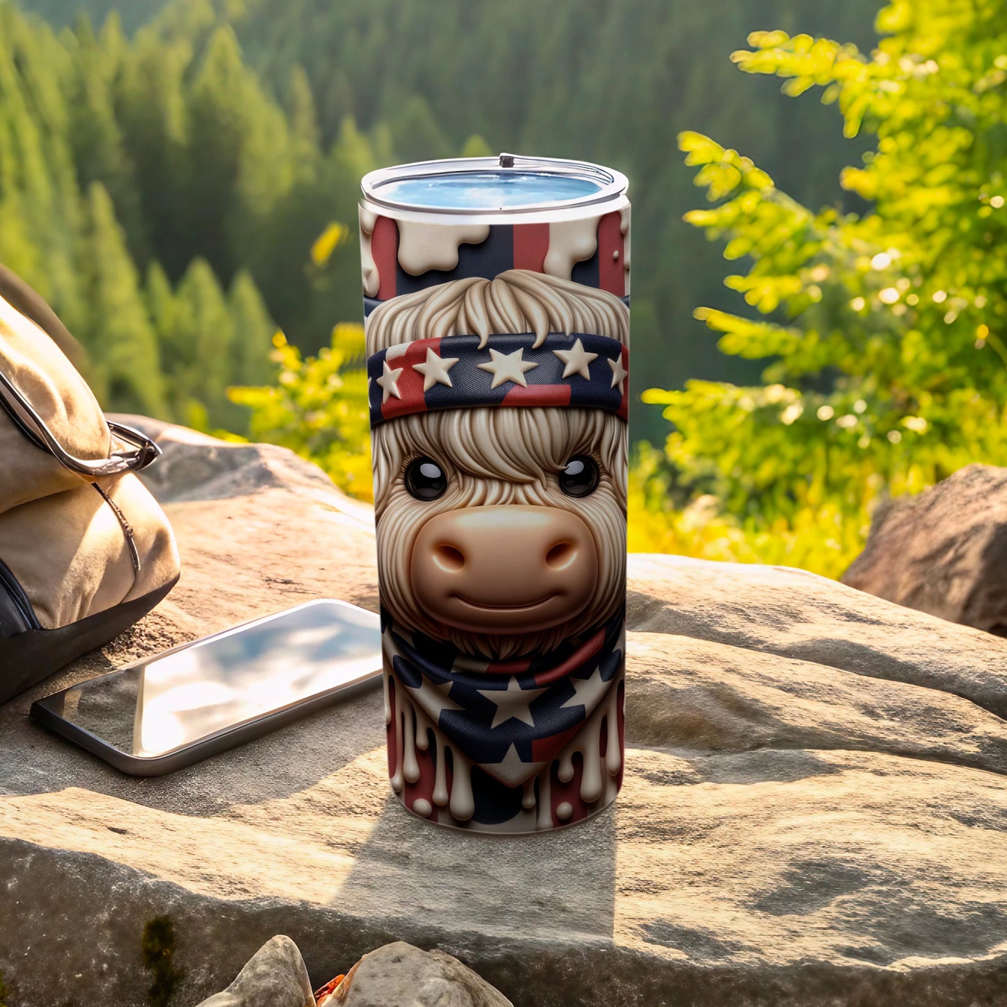 Highland cow in patriotic bandana on patriotic tumbler, outdoors.