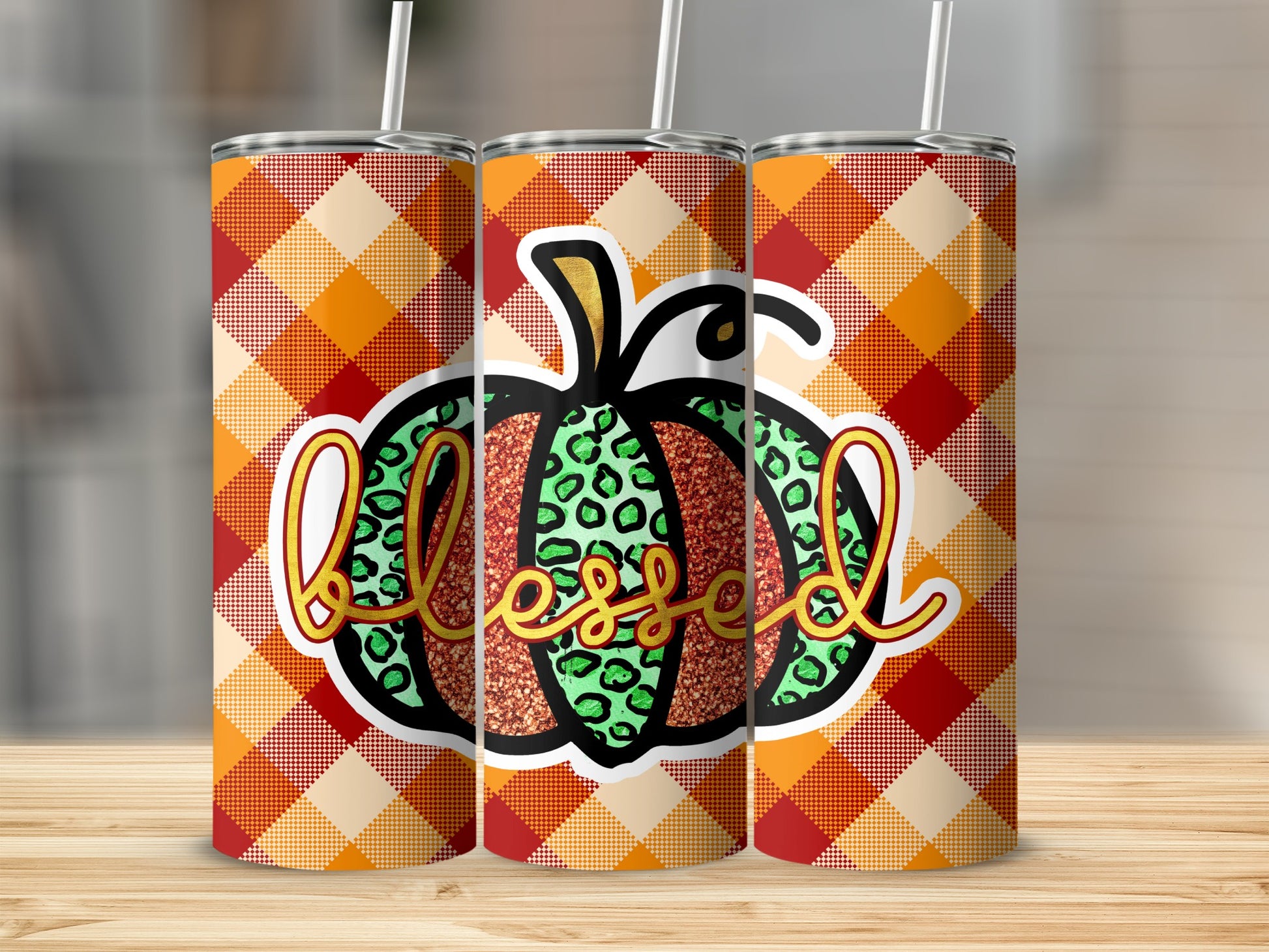 Three tumblers with orange and yellow plaid and "Blessed" pumpkin design.