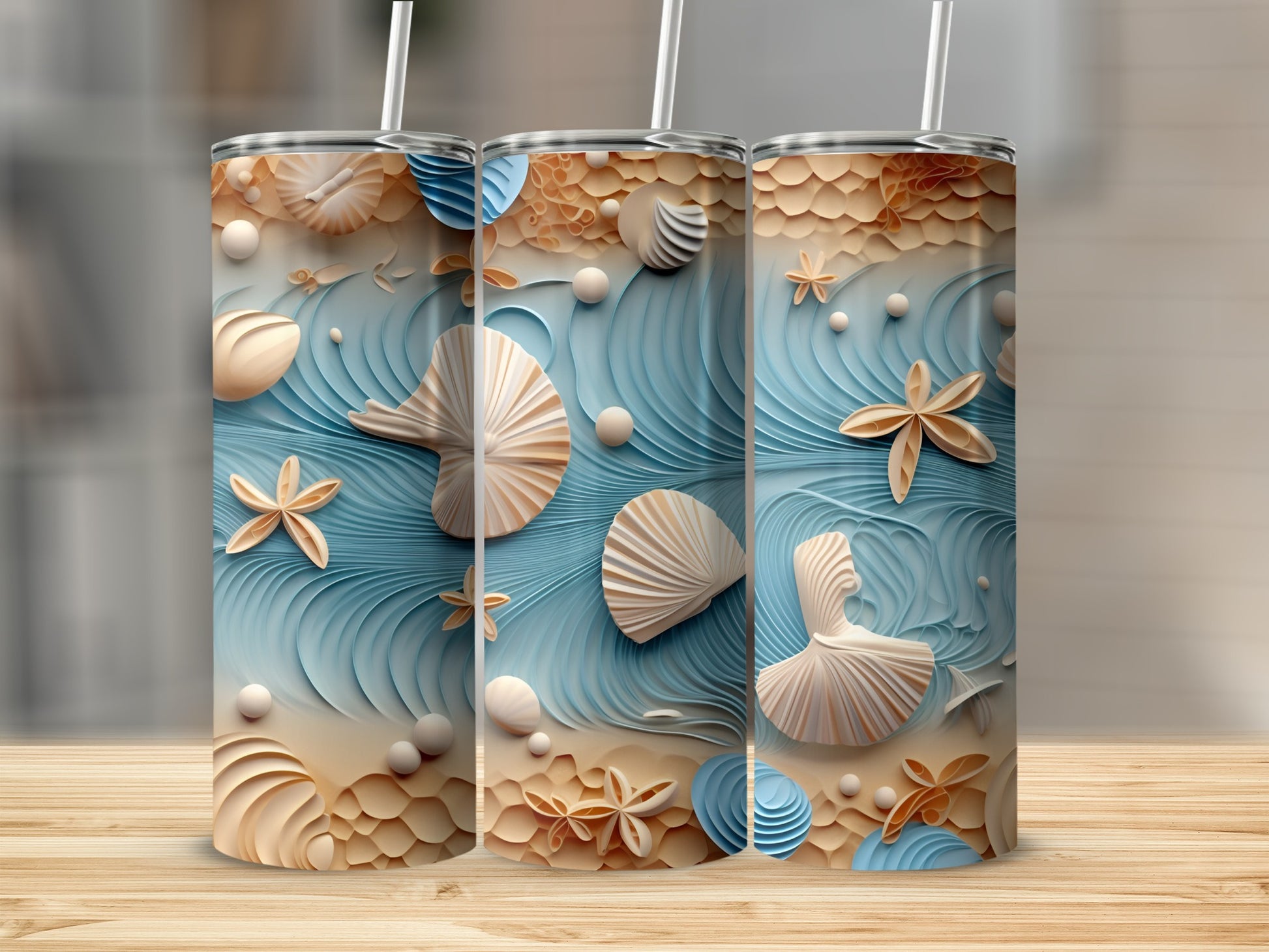 Three tumblers with a textured seashell and starfish beach design.