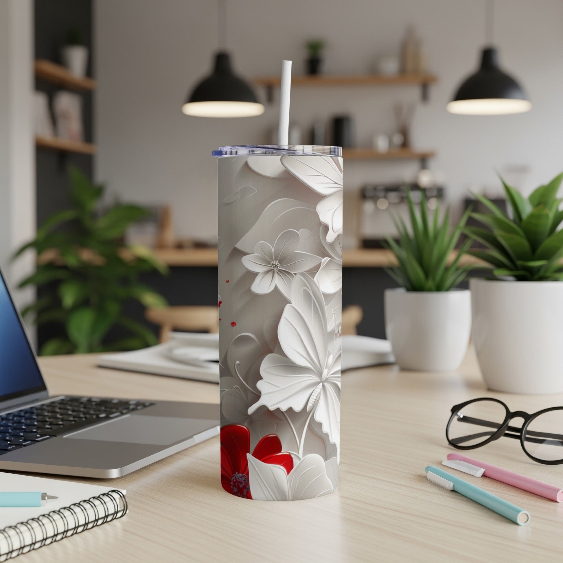 White tumbler with floral and butterfly pattern, red accents.