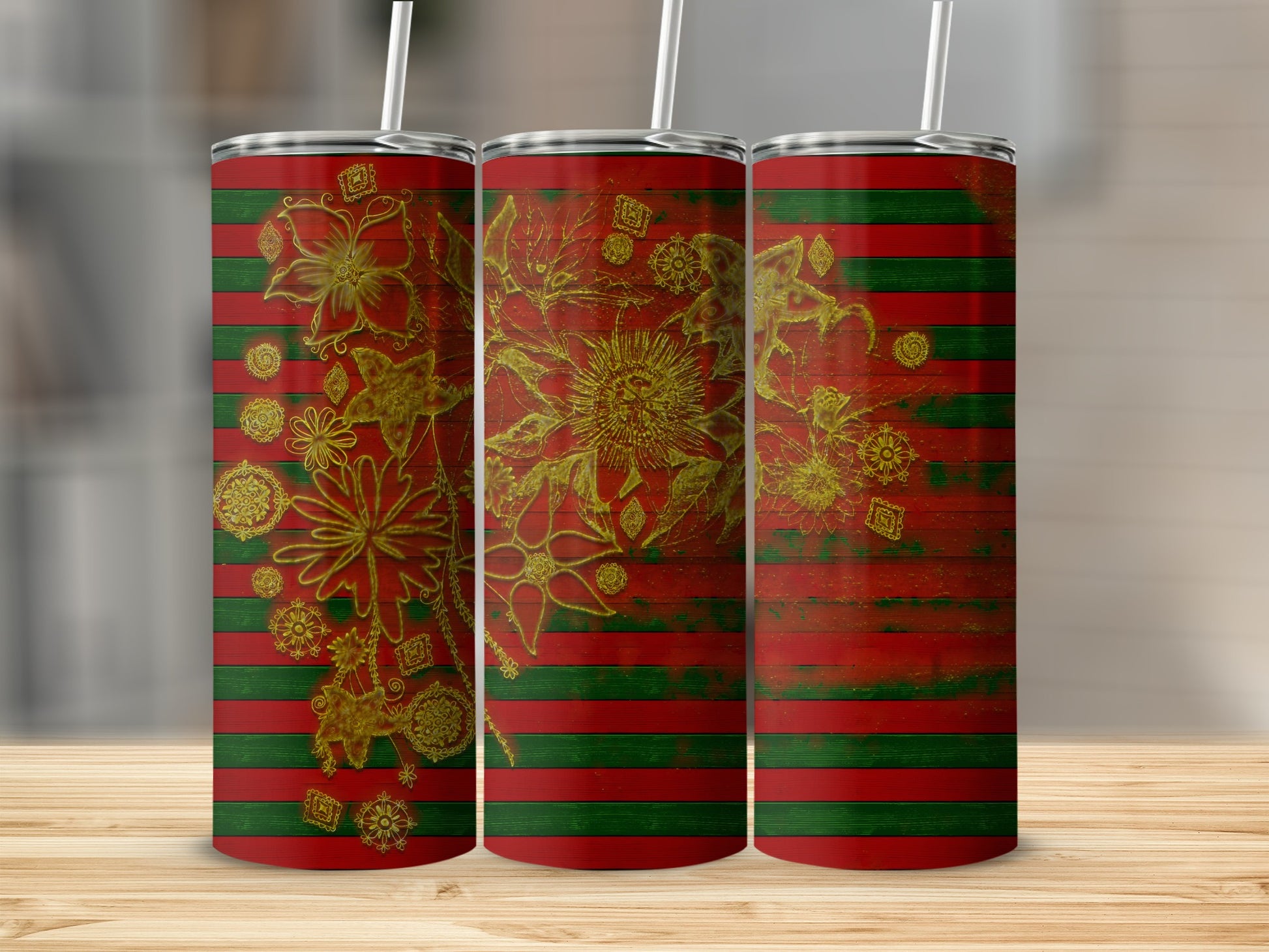 Three tumblers with green and red striped pattern and gold floral designs.
