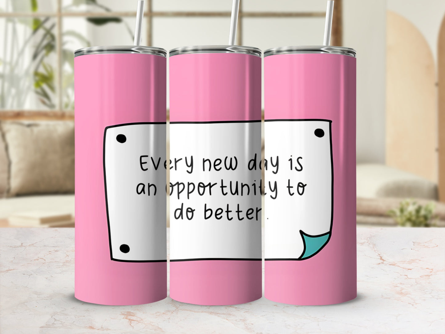 Pink tumbler with a white note saying "Every new day is an opportunity to do better."