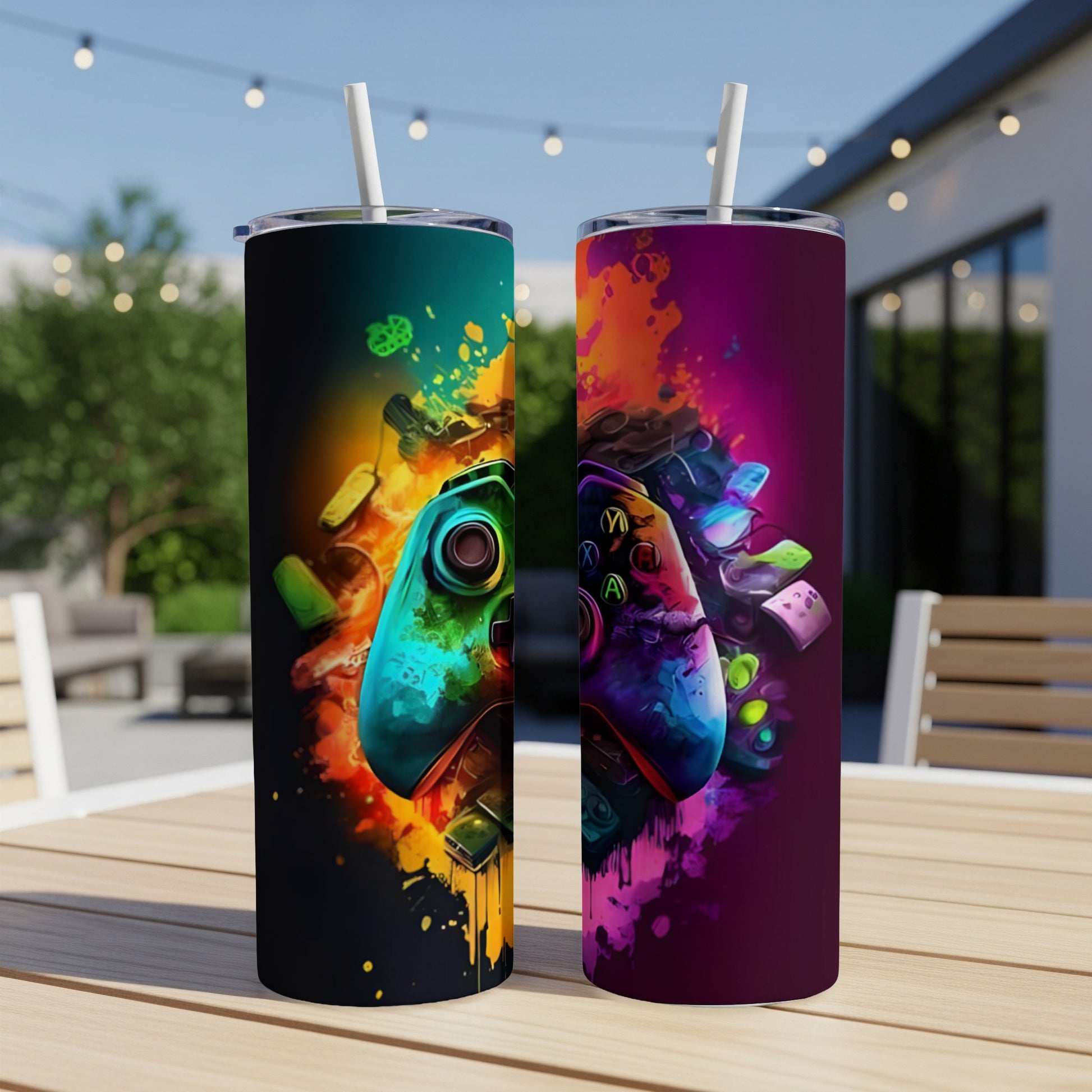 Two tumblers with video game controllers and colorful, abstract paint splatters.