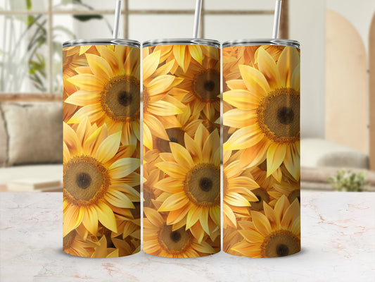 Sunflower patterned tumbler with straw, shown on marble surface.