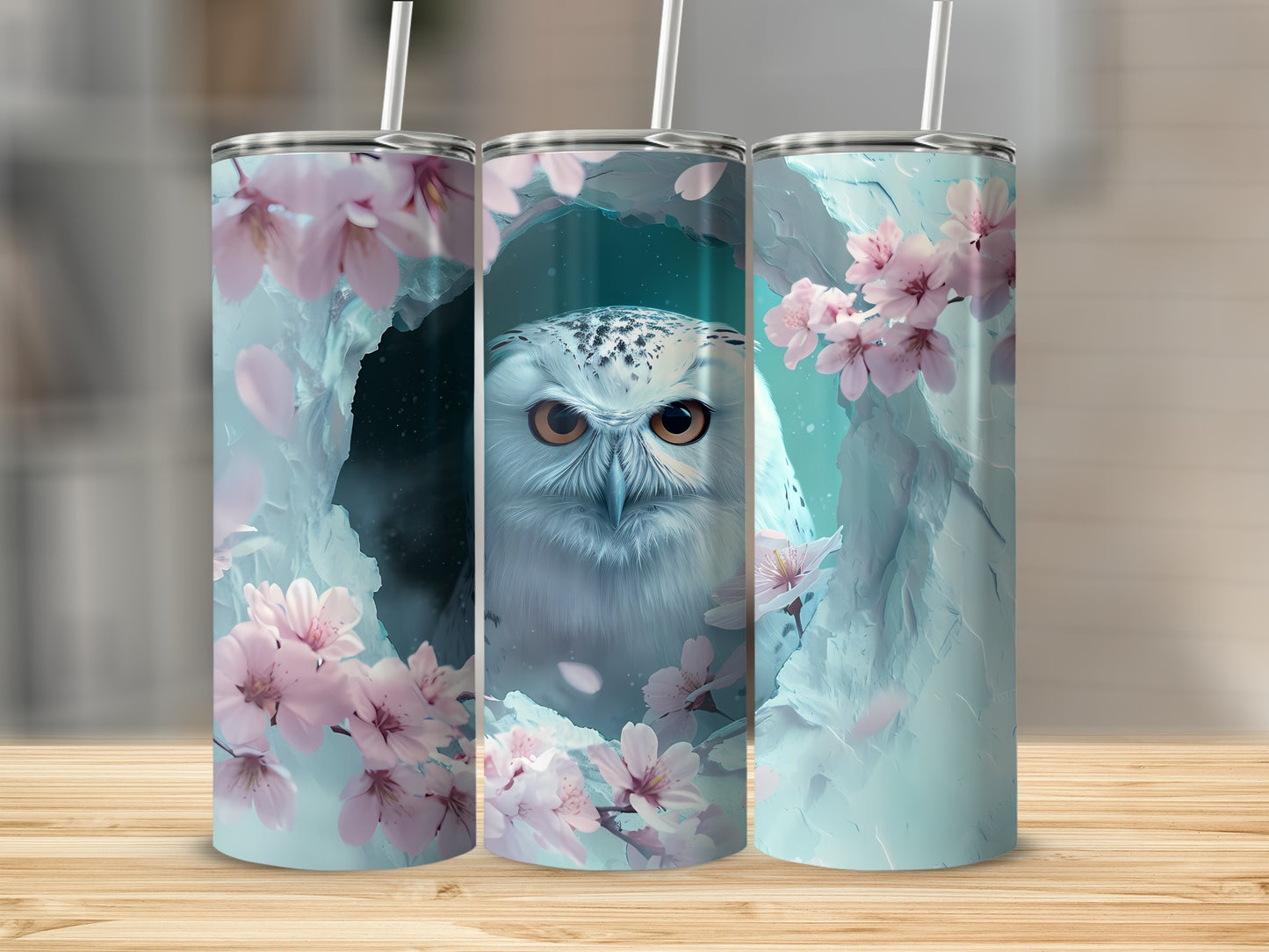 Snowy owl with cherry blossoms on a blue speckled tumbler.