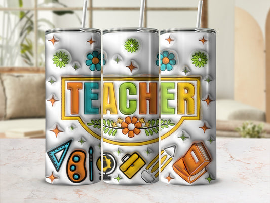 Tumbler with "TEACHER" text, colorful flowers, art supplies, and books.