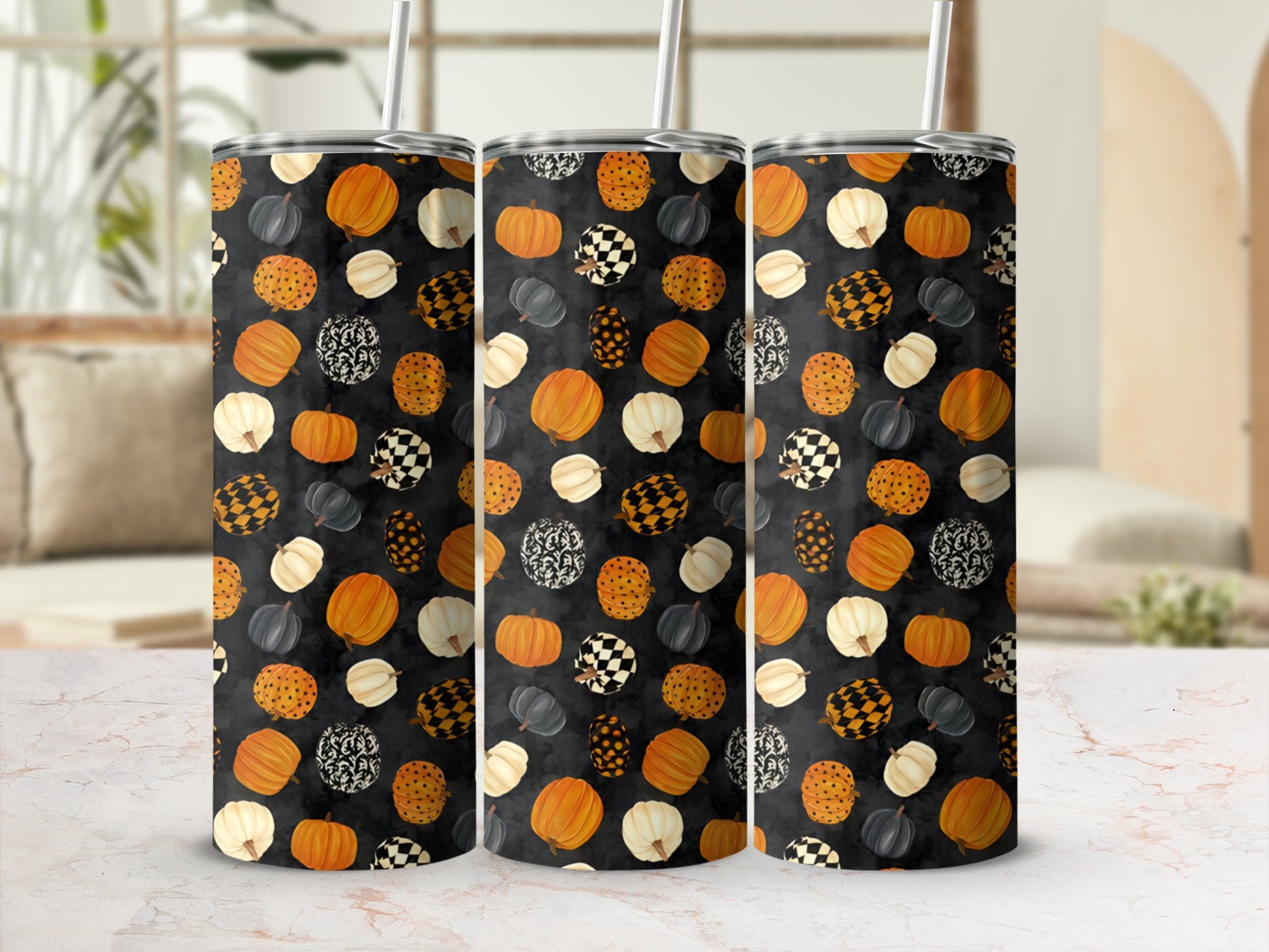 Three tumblers with a black background filled with pumpkins and checkerboard patterns.