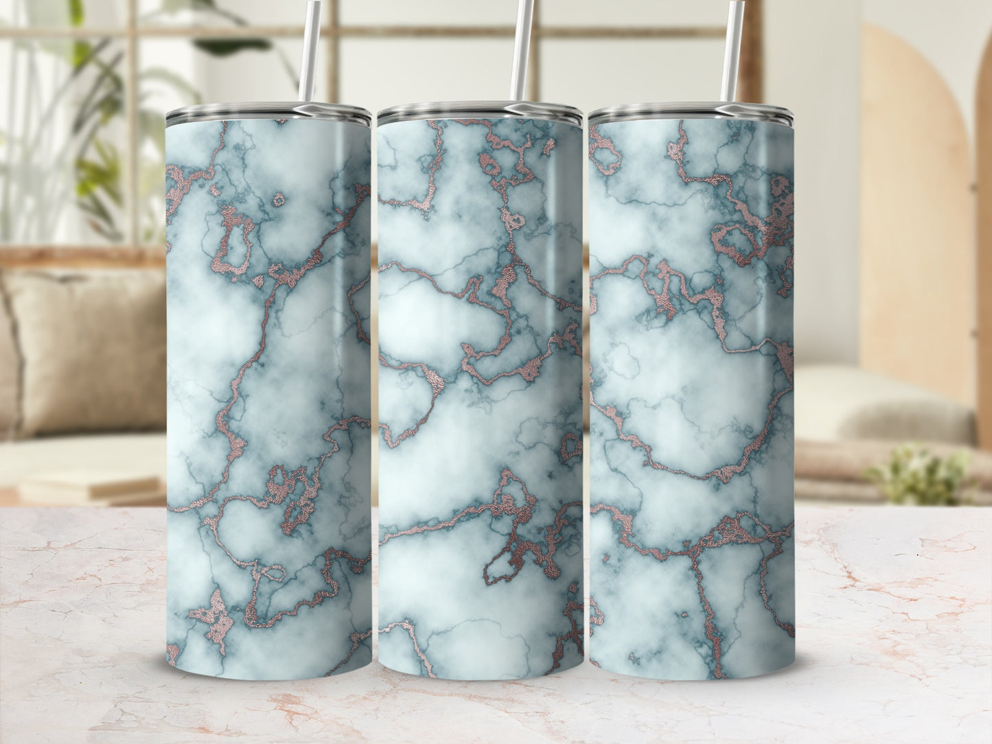 Three tumblers with a marbled blue and rose gold design.
