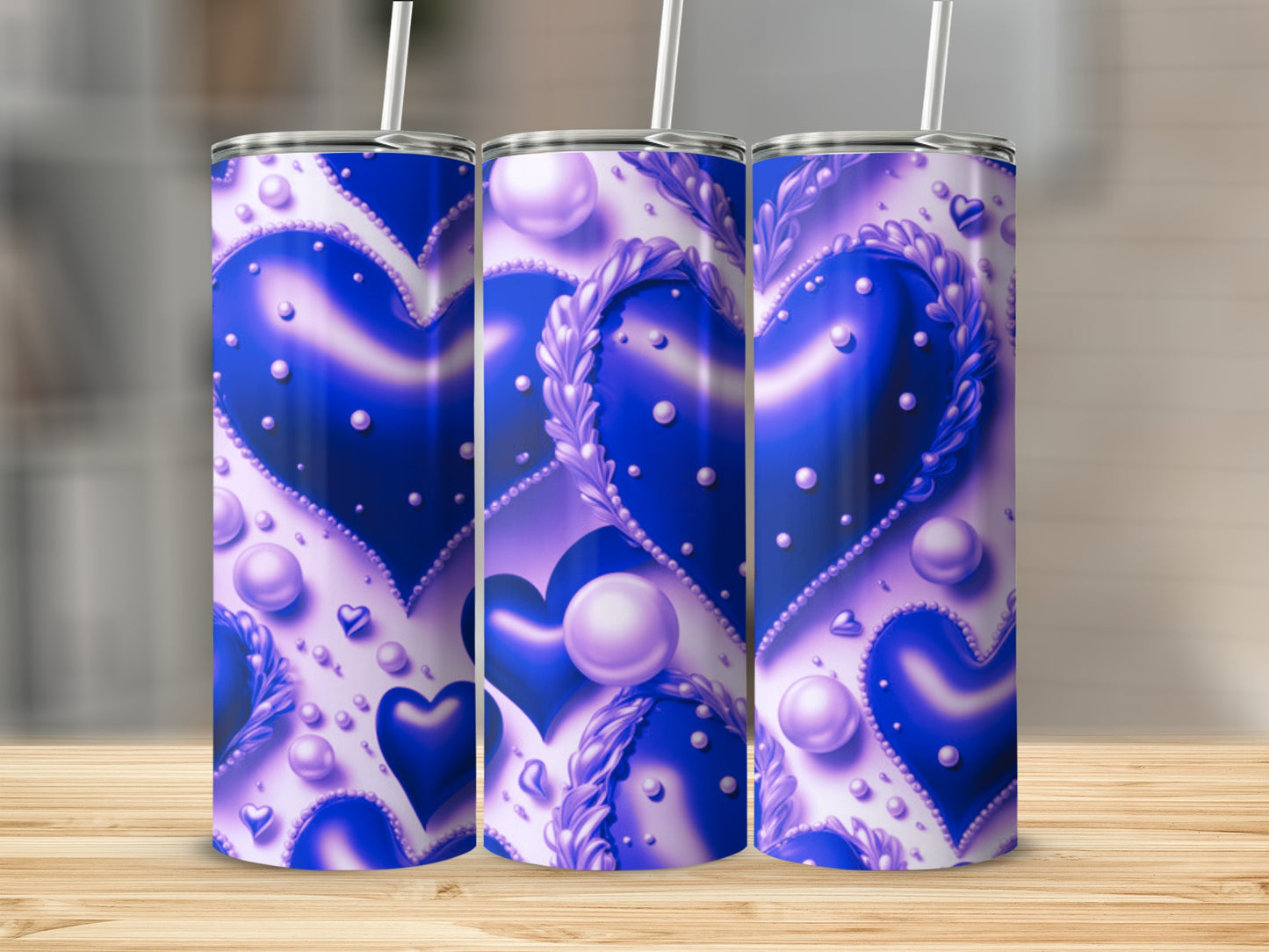 Three purple hearts with pearl accents on a white background.