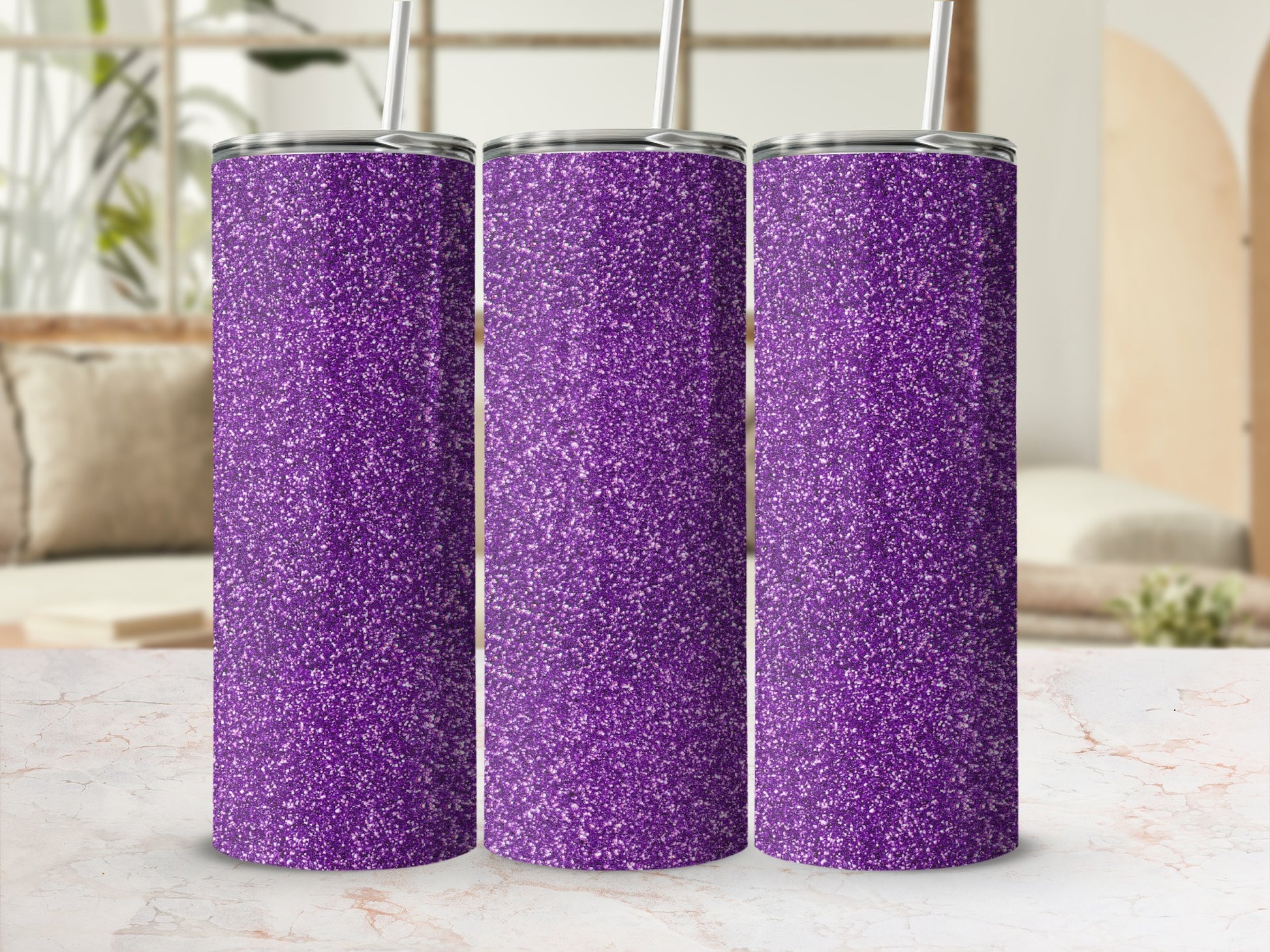 Three purple glitter tumblers with straws sit in a row.