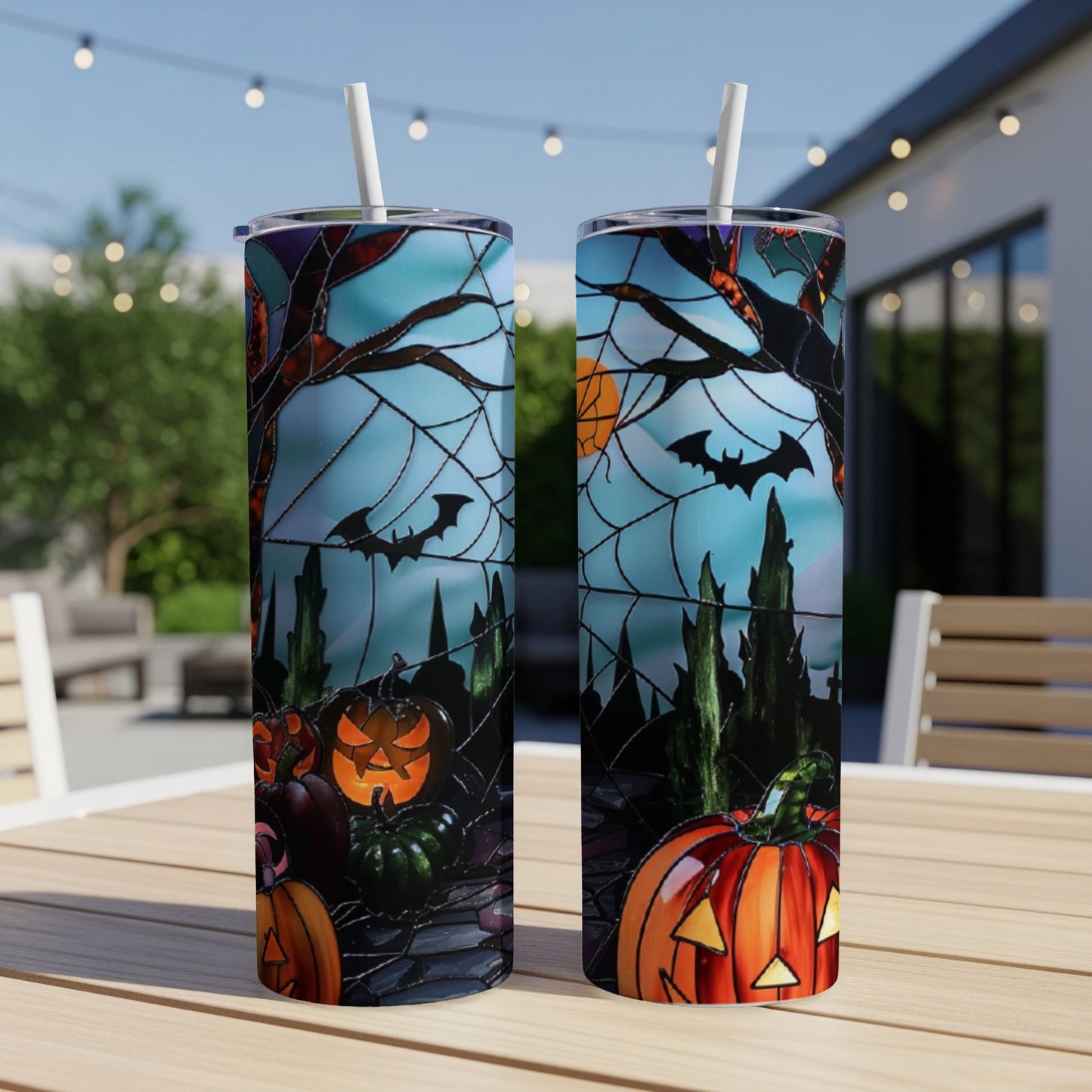 Two tumblers with Halloween stained-glass design featuring pumpkins, bats, and cobwebs.