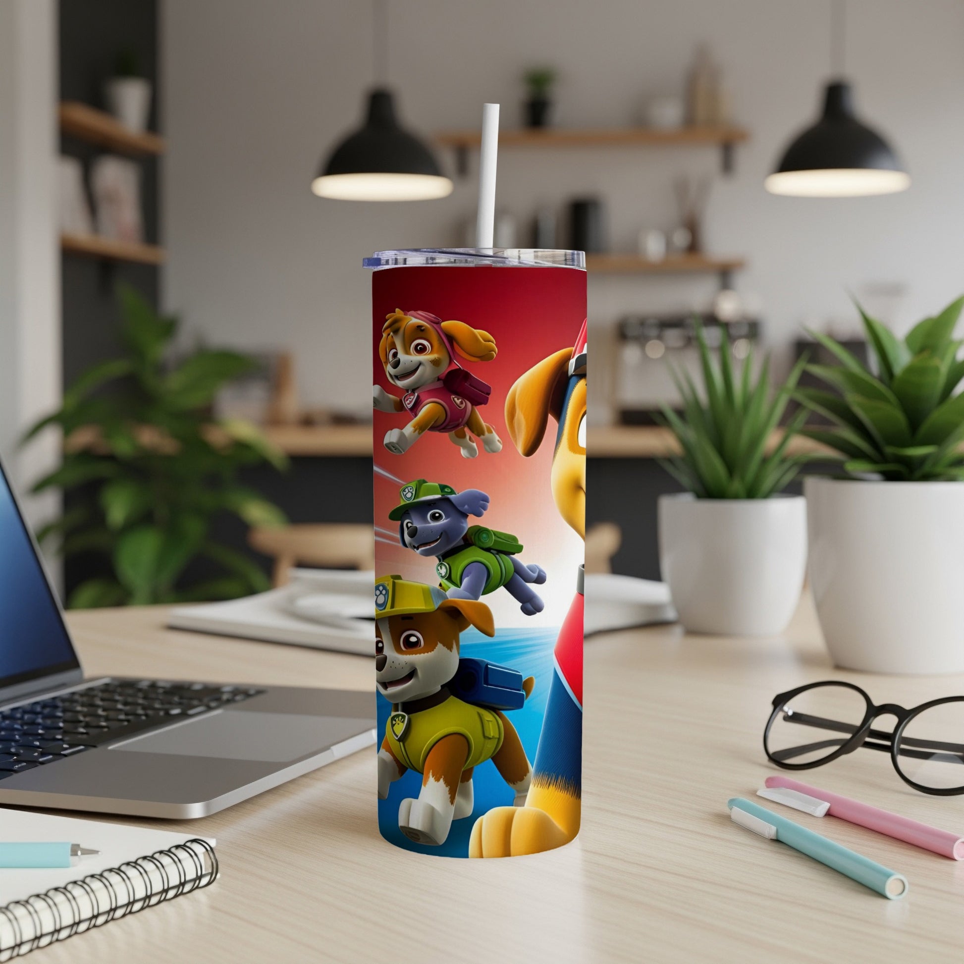 Paw Patrol characters Chase, Marshall, and Skye on a red and blue tumbler.