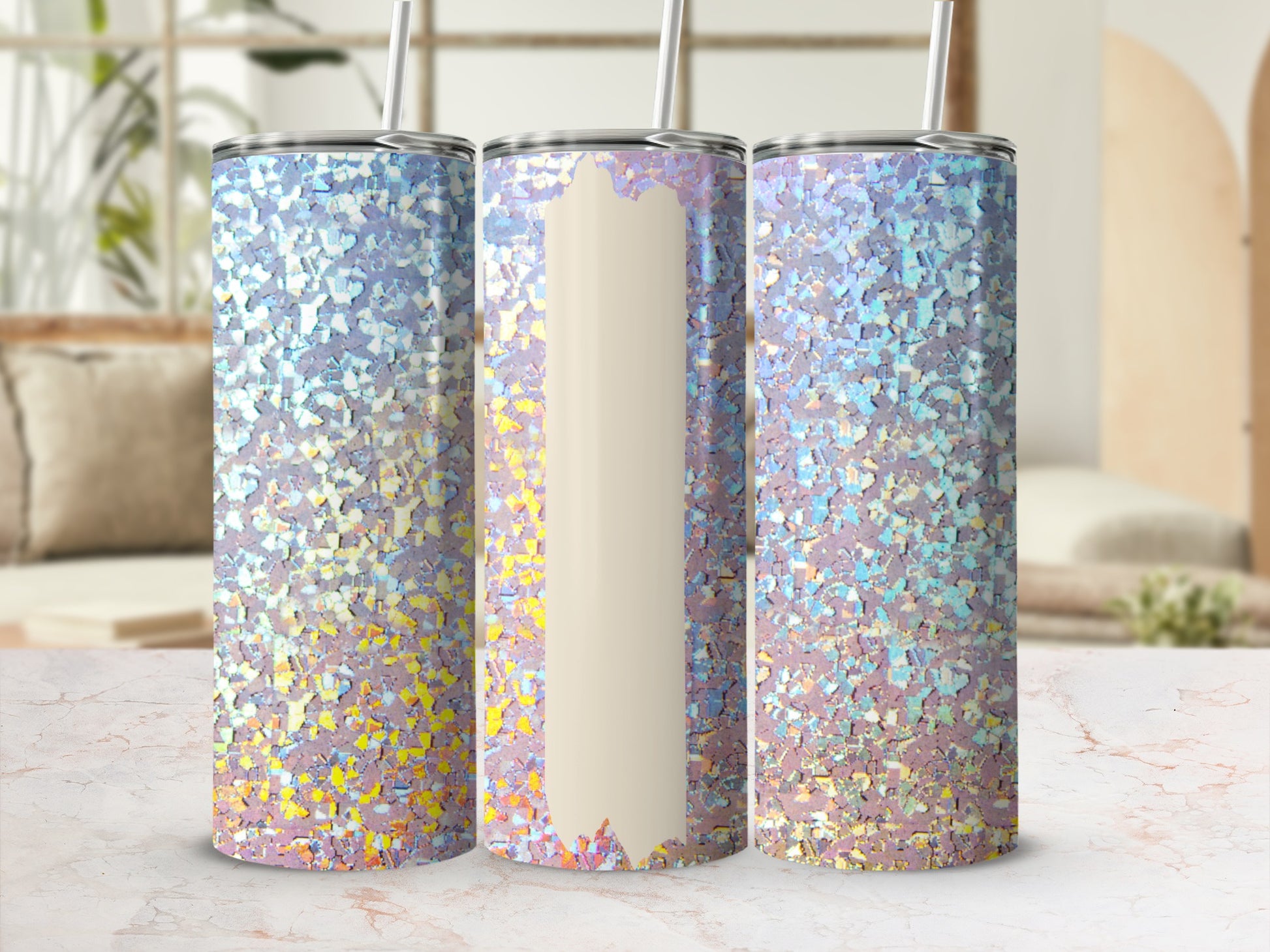 Three holographic glitter tumblers with straws on a marble surface.