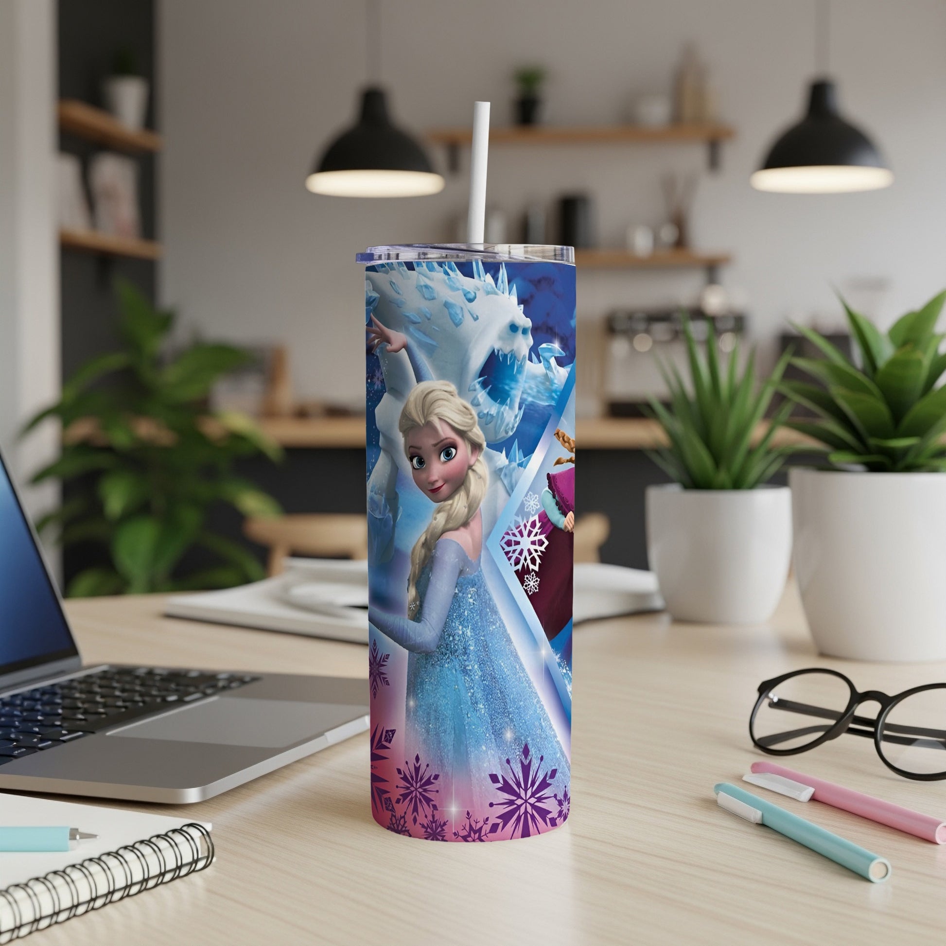 Elsa from Frozen on a tall tumbler with snowflakes.