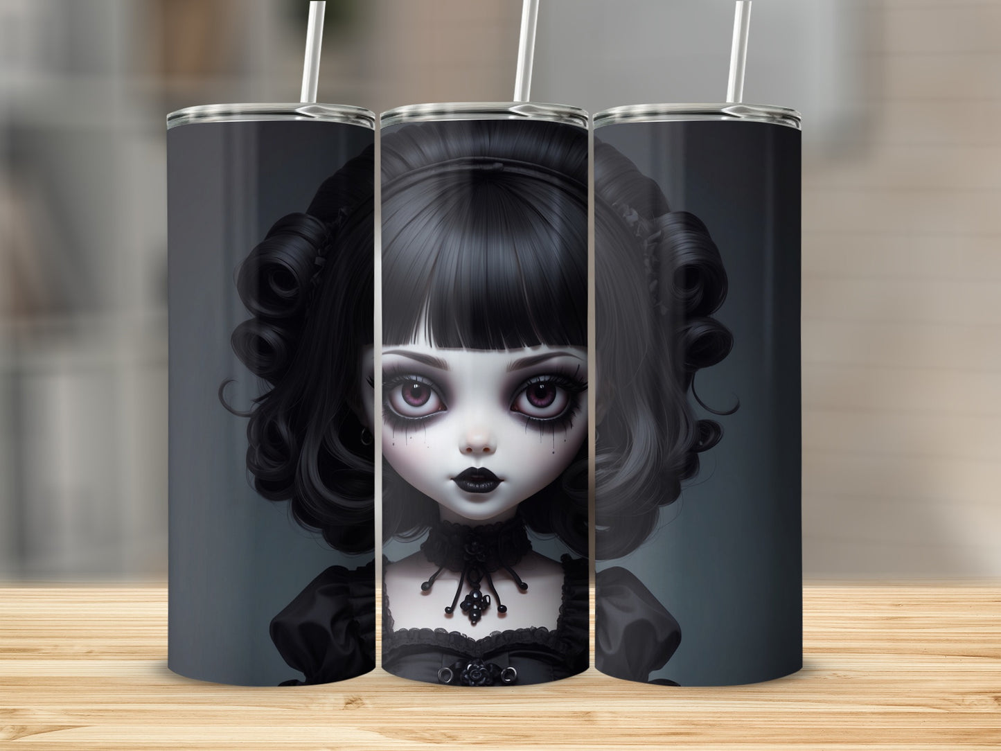 Gothic doll artwork on three stainless steel tumblers.