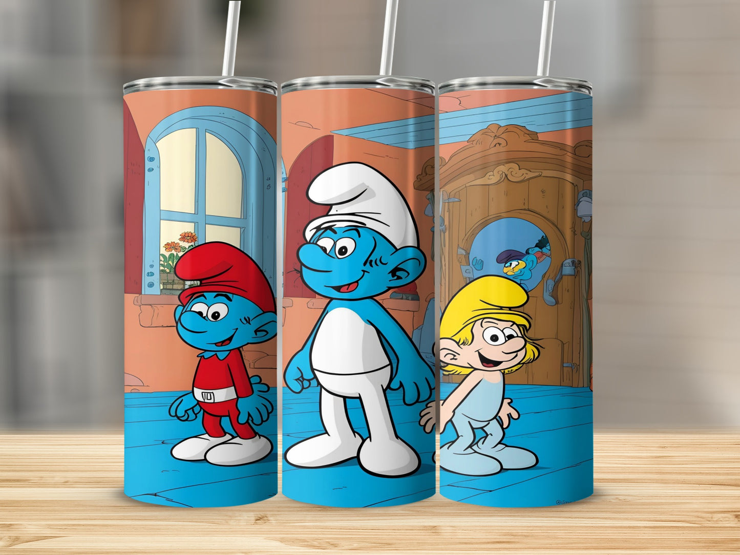 Three Smurfs in cartoon style on a tumbler with a wooden background.