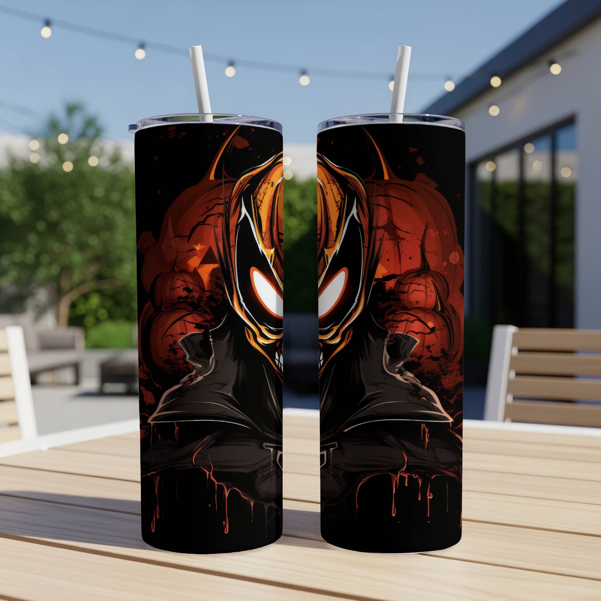 Two tumblers with a spooky Halloween-themed villain design featuring glowing eyes and pumpkins.