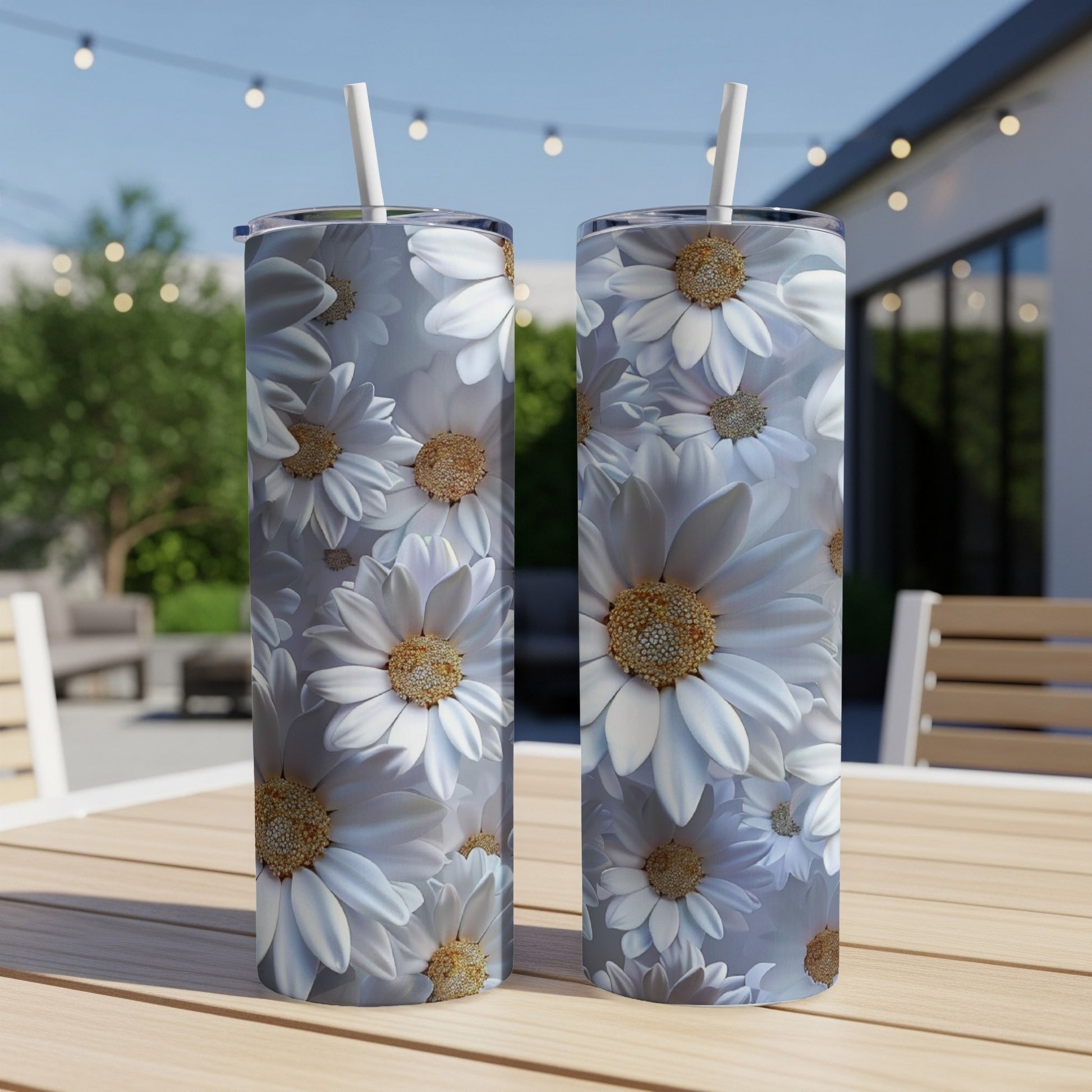 Two tall tumblers with a repeating white daisy floral pattern.