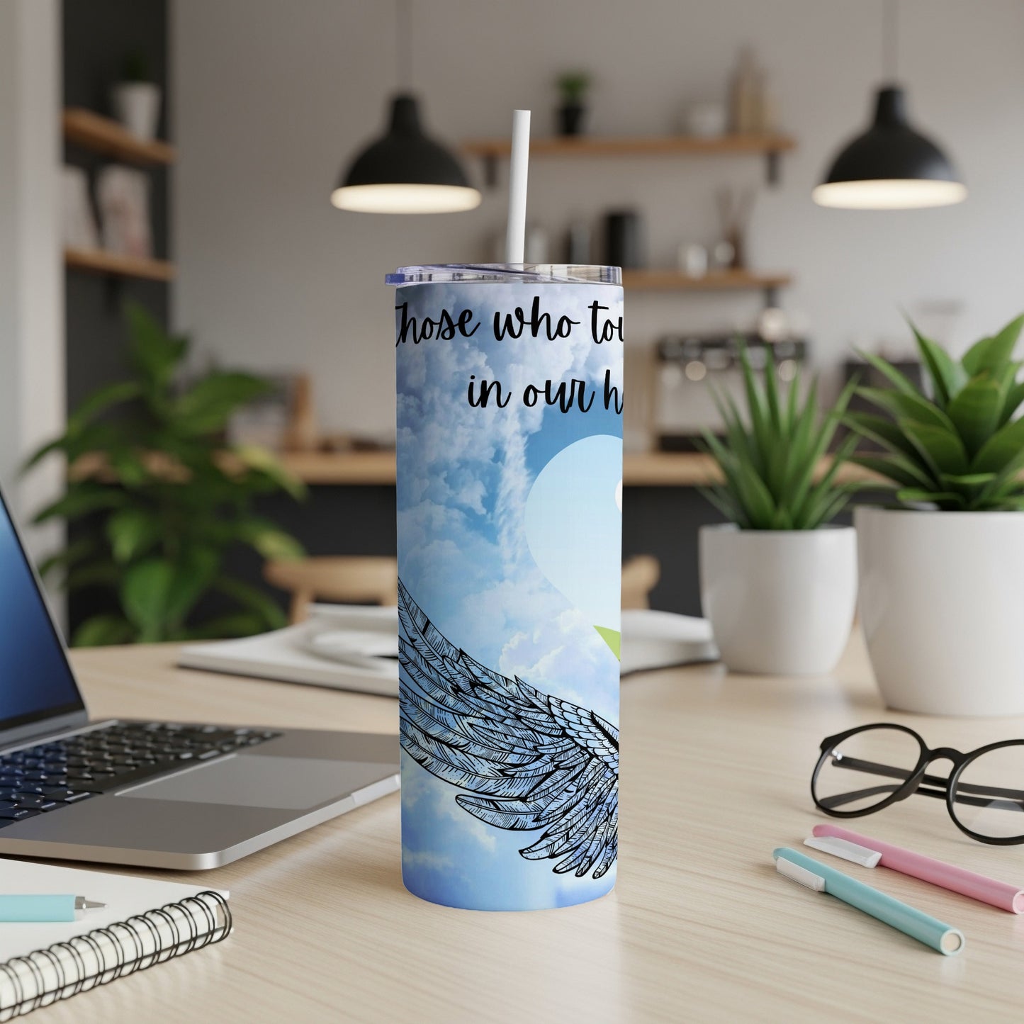 Tumbler with angel wings and text "Those who touch our hearts stay in our hearts forever".