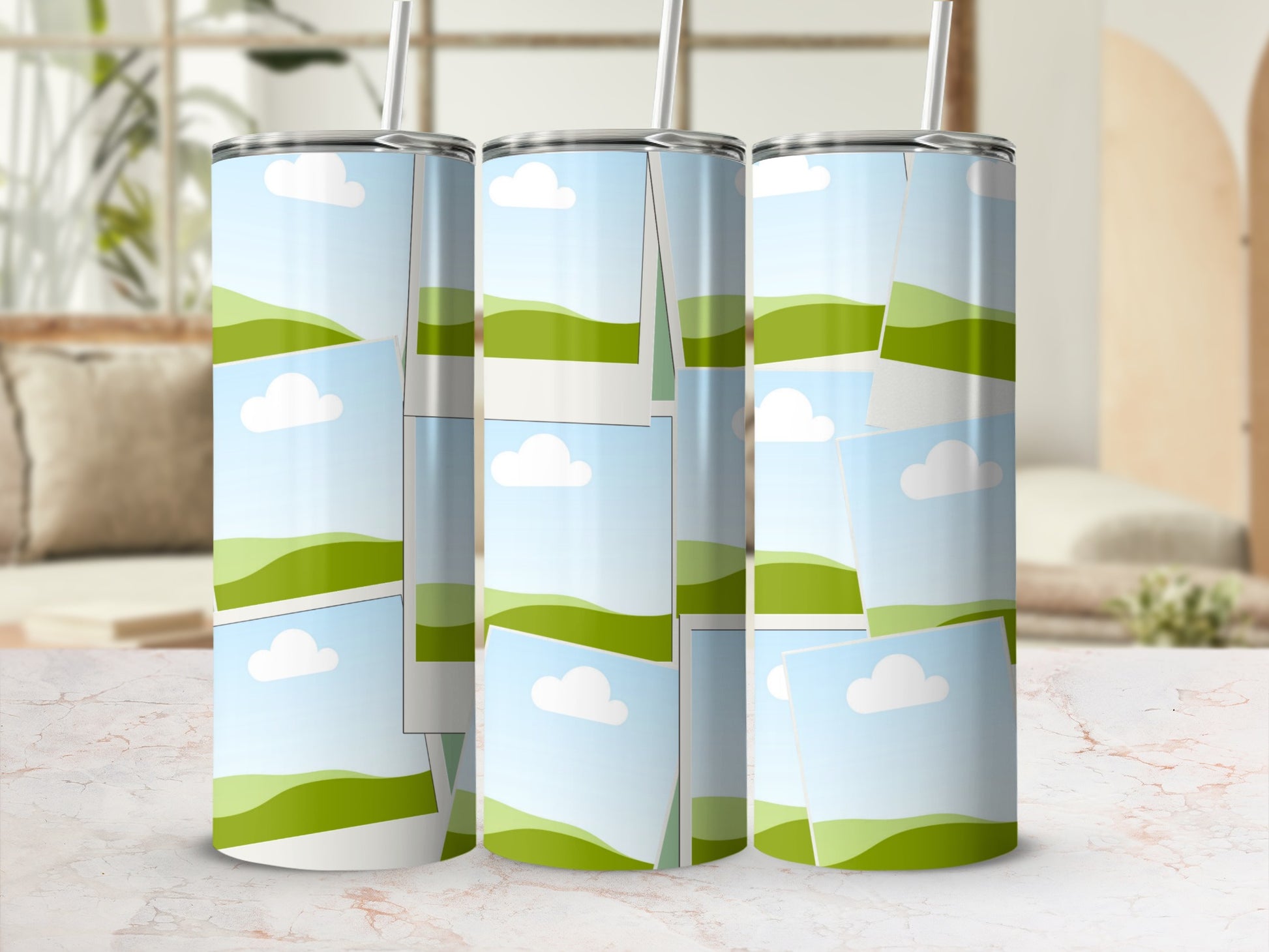 Three tumblers with a collage of landscape photos of rolling green hills and clouds.