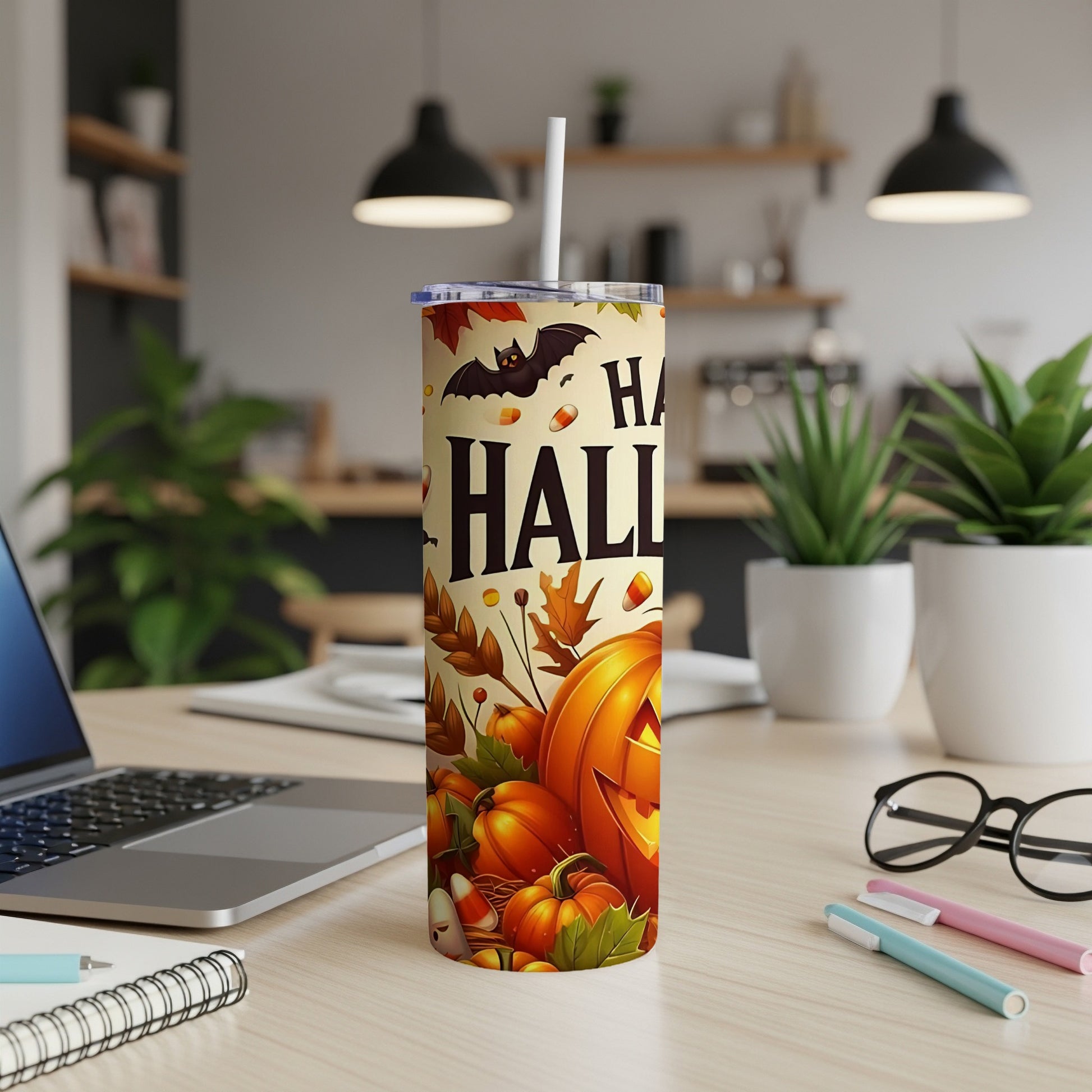 Halloween tumbler with pumpkins, bats, and text reading "Happy Halloween".