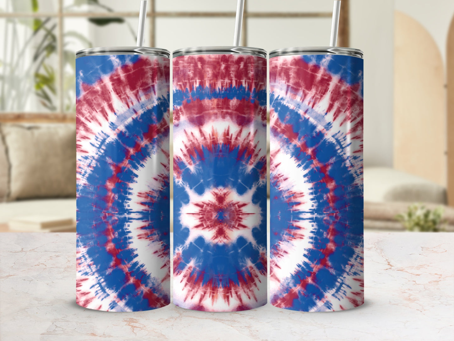 Three tumblers with red, white, and blue tie-dye patterns and straws.