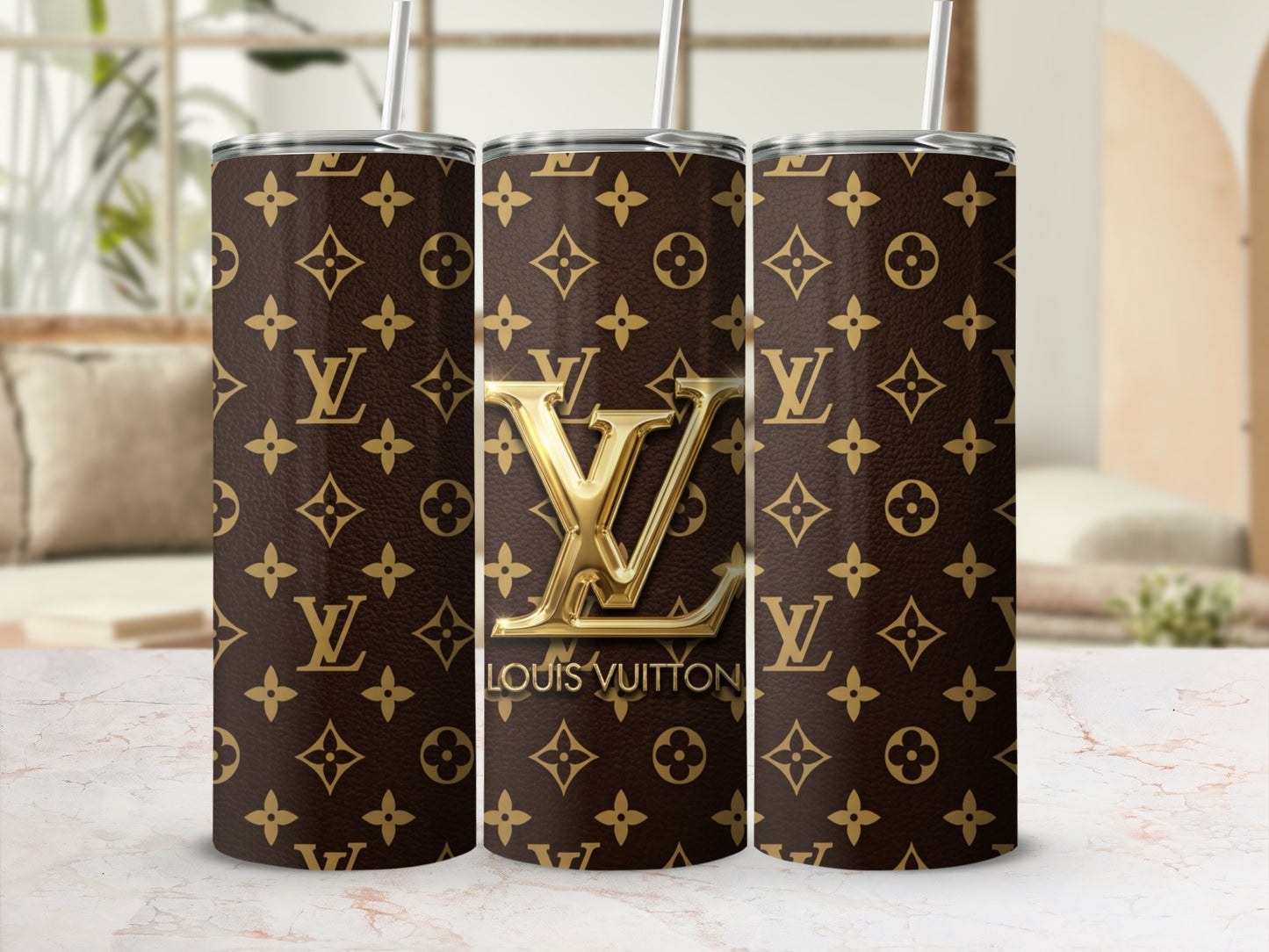 Tumblers with Louis Vuitton monogram pattern and gold logo.