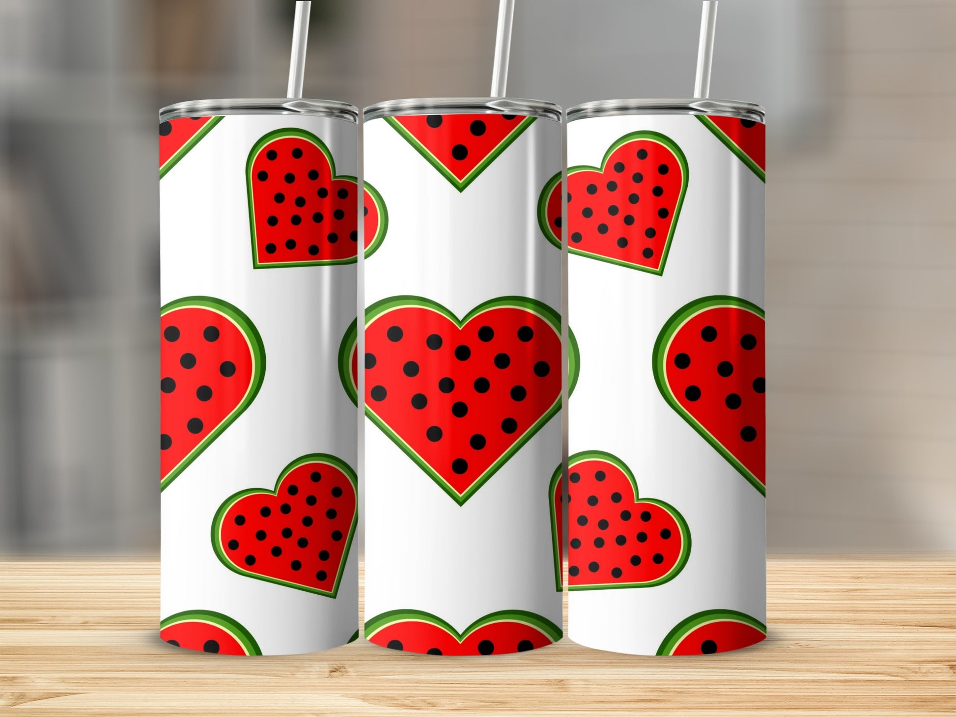 Three white tumblers with a repeating red watermelon heart pattern.