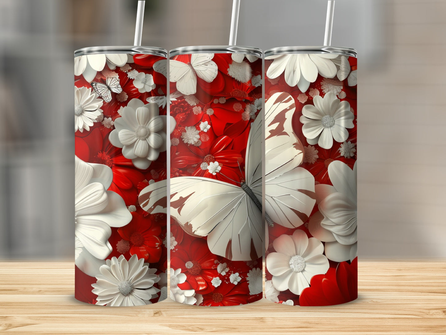 Three tumblers with a red floral and butterfly design.