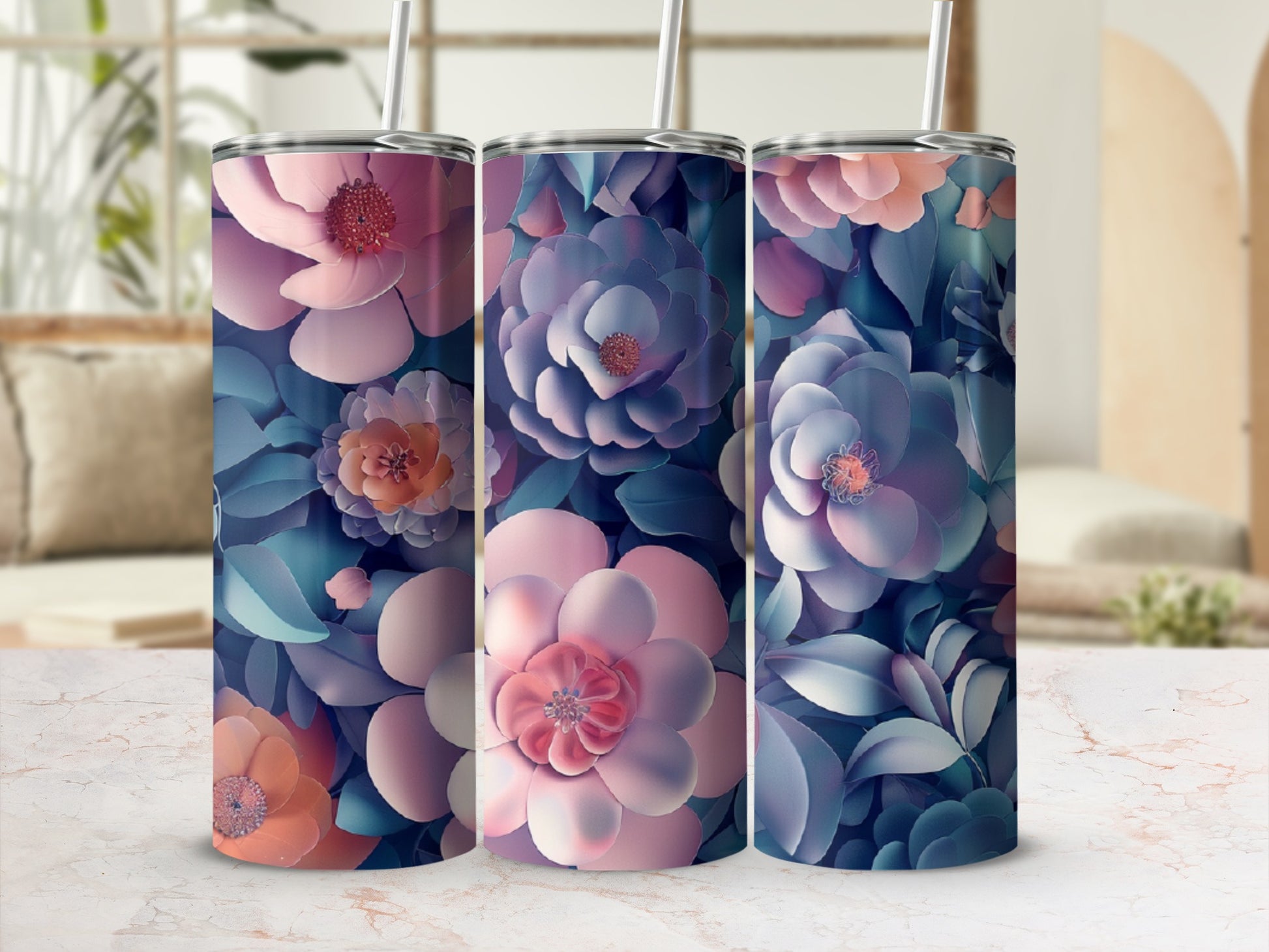 Three tumblers with a watercolor floral design in pinks, blues, and purples.
