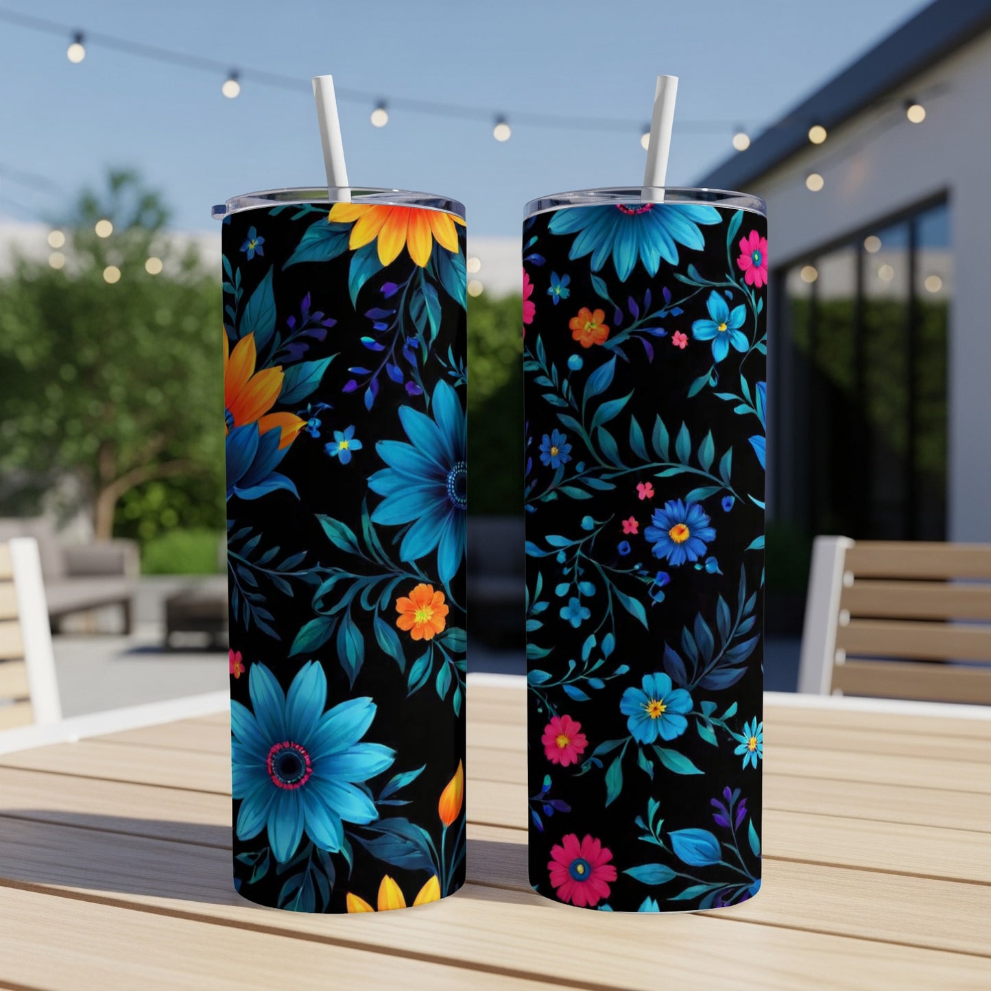 Two tumblers with a dark floral pattern of blue, pink, and orange flowers.