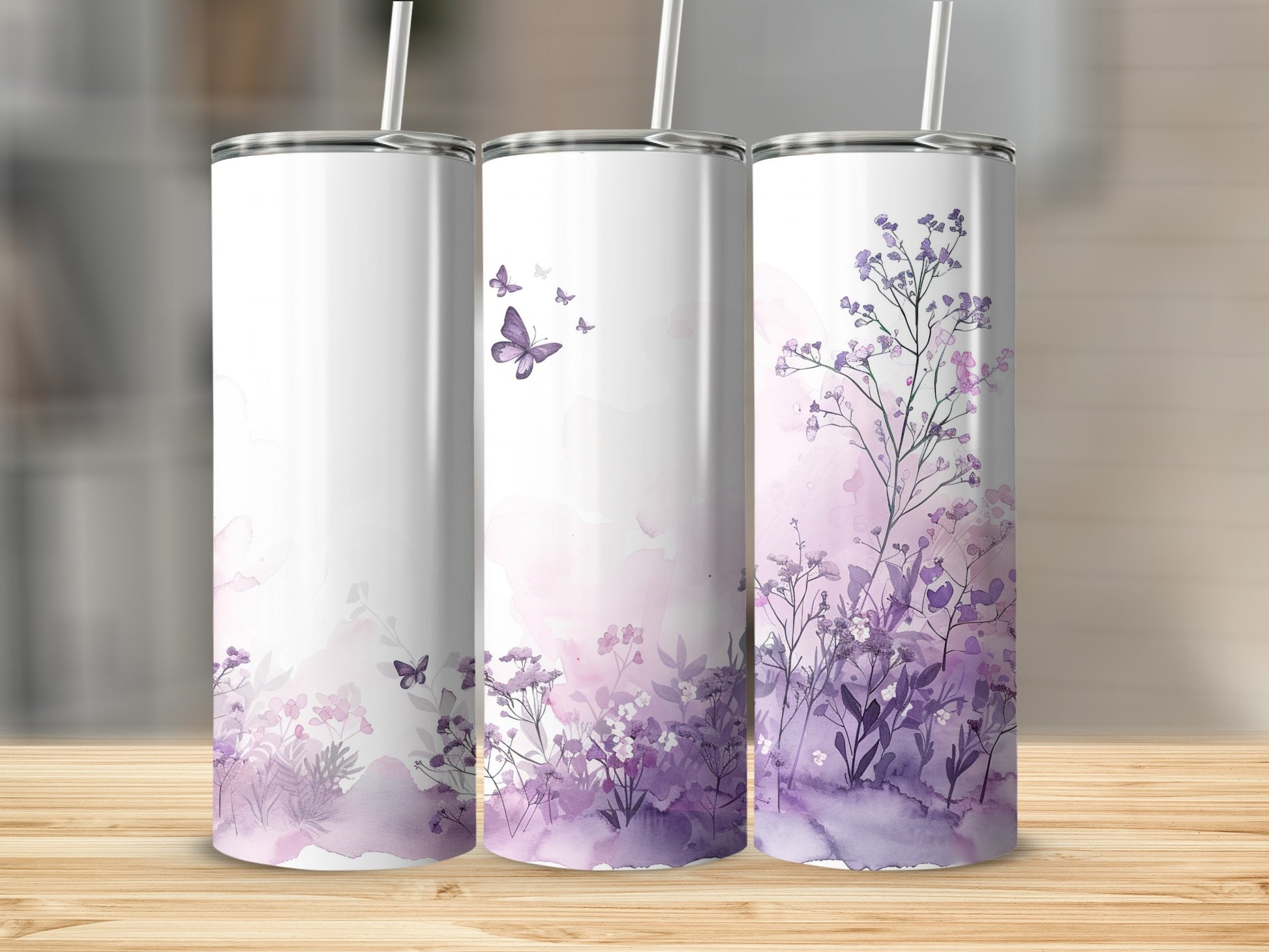 Three tumblers with purple floral and butterfly designs.