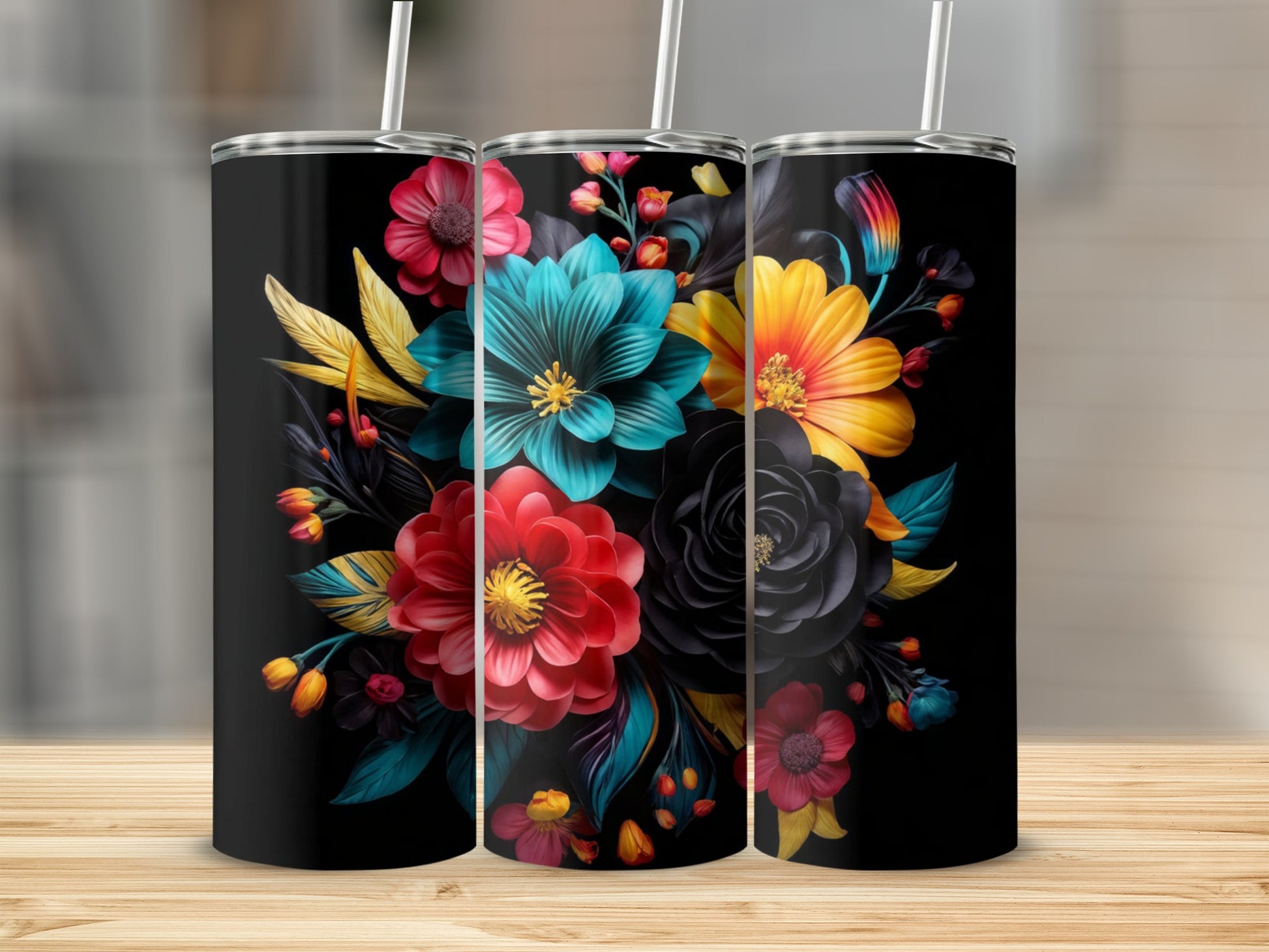 Three black tumblers displaying a vibrant floral bouquet design.