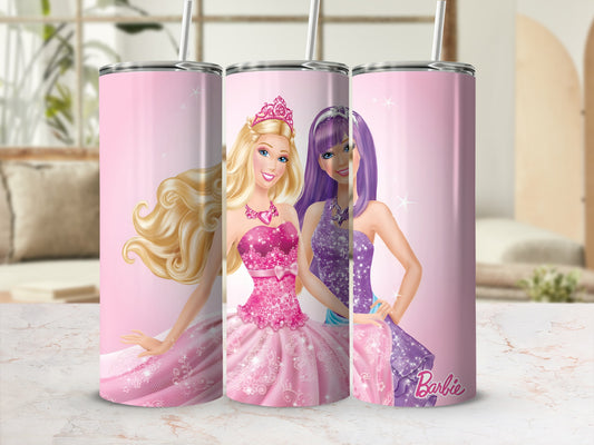 Barbie dolls in pink and purple sparkly dresses with straws on a textured surface.