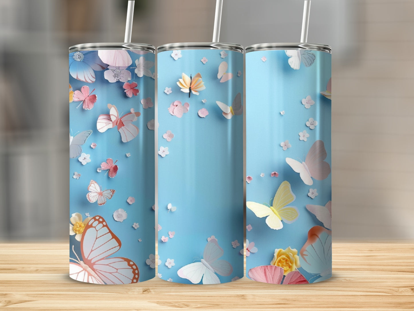 Light blue tumbler with colorful butterflies and floral accents.