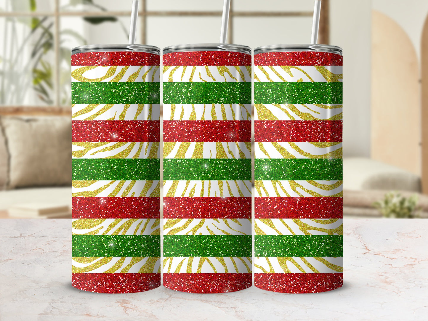 Three glitter-covered tumblers with red, green, and gold horizontal stripes.
