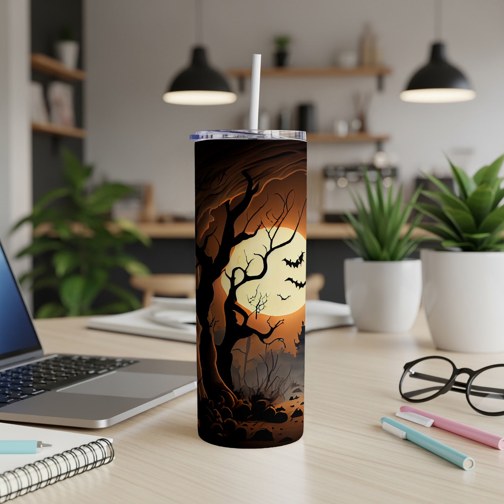 Tall Halloween tumbler with spooky forest, moon, and bats design.