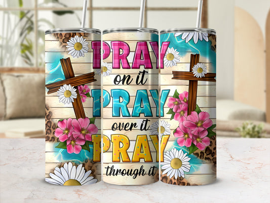 Tumbler with wood grain, leopard print, crosses, daisies, and pink flowers.