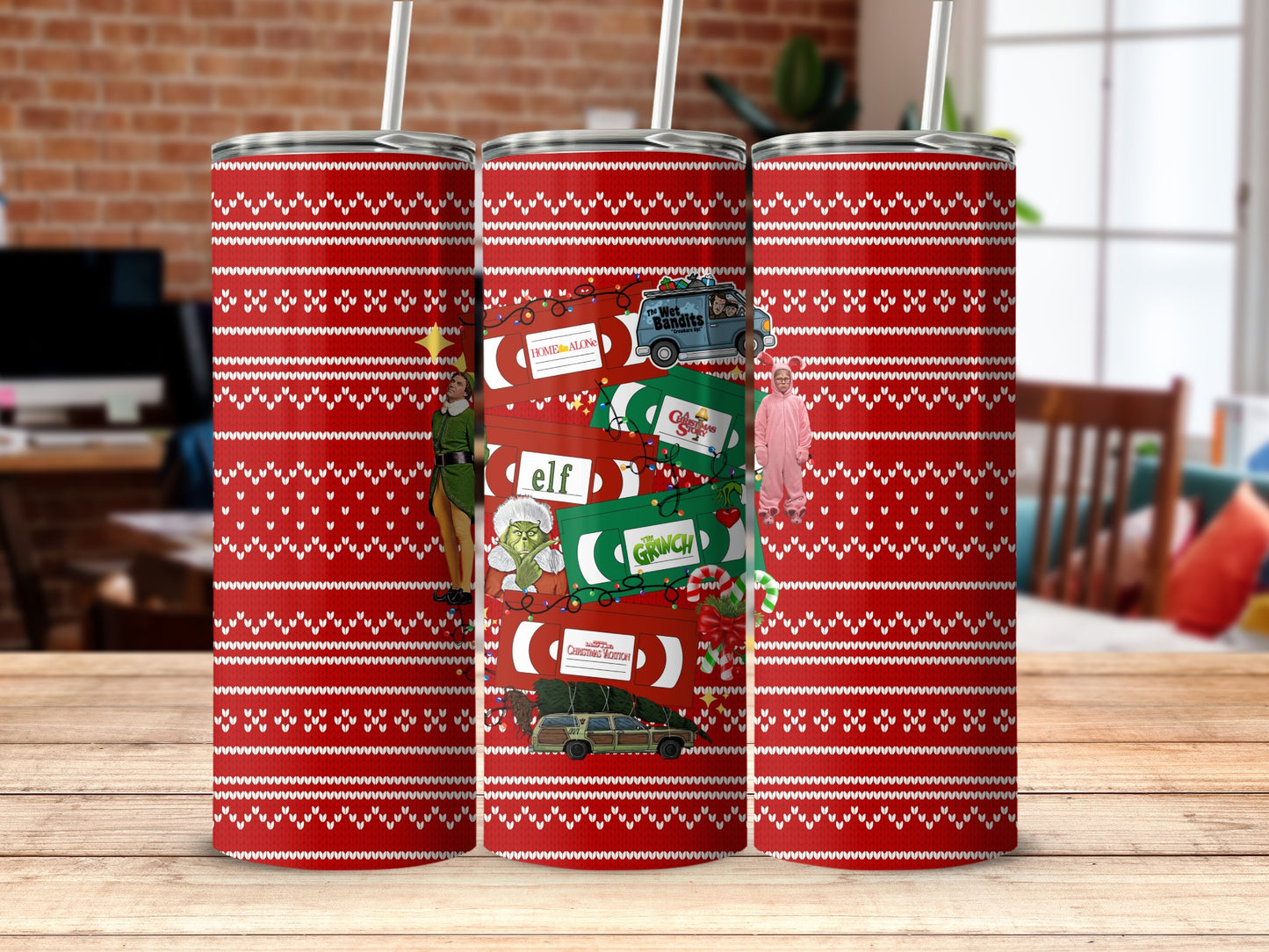 Red patterned tumblers featuring Home Alone, Elf, and The Grinch Christmas movie designs.