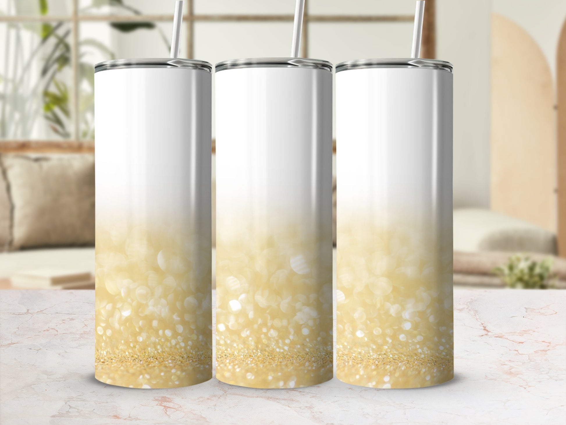 Three white tumblers with a sparkling gold glitter ombre design.