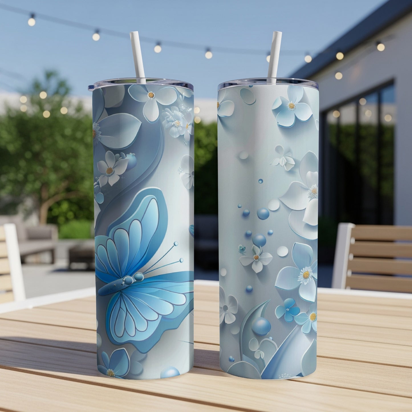 Two tall tumblers with a blue butterfly and floral design.