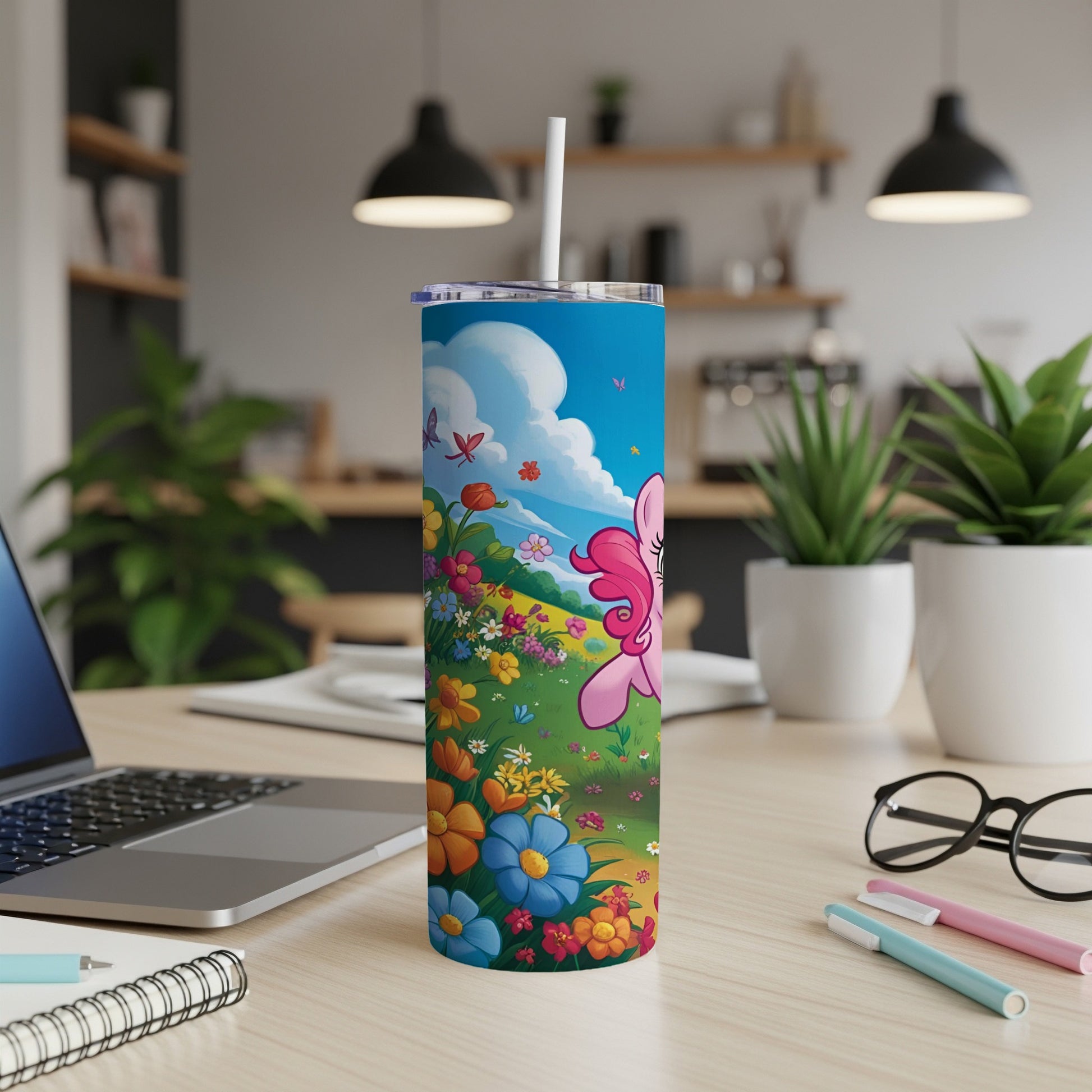 Pink cartoon pony in a colorful field of flowers and butterflies on a tumbler.