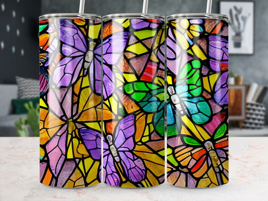 Three tumblers with colorful stained-glass butterfly designs.